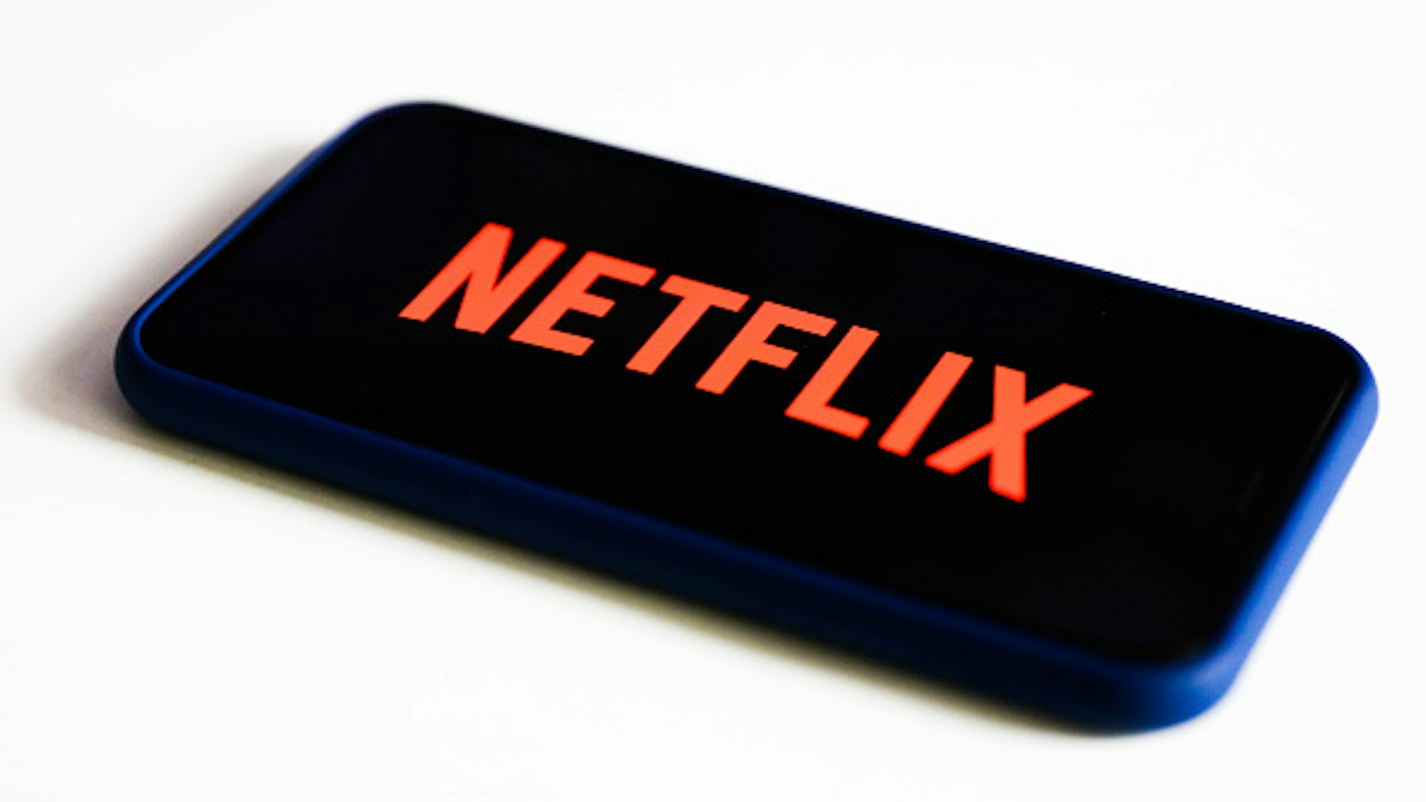 Netflix logo is seen displayed on phone screen in this illustration photo taken in Poland on July 17, 2020. On-Demand streaming services gained popularity and new subscribers during the coronavirus pandemic.