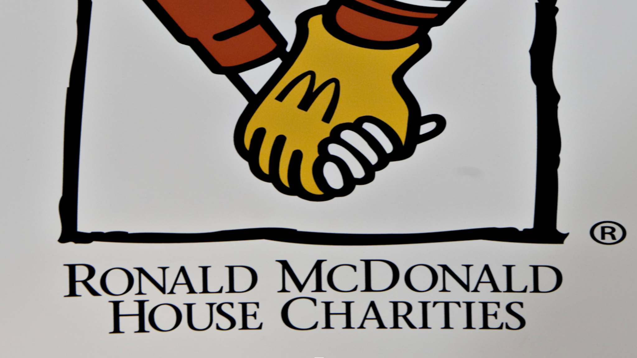 A Ronald McDonald House Charities logo sits on display on the sidelines of the Berkshire Hathaway annual meeting in Omaha, Nebraska, U.S., on Saturday, May 1, 2010. Ronald McDonald house exists to "create, find and support programs that directly improve the health and well being of children," according to its website.