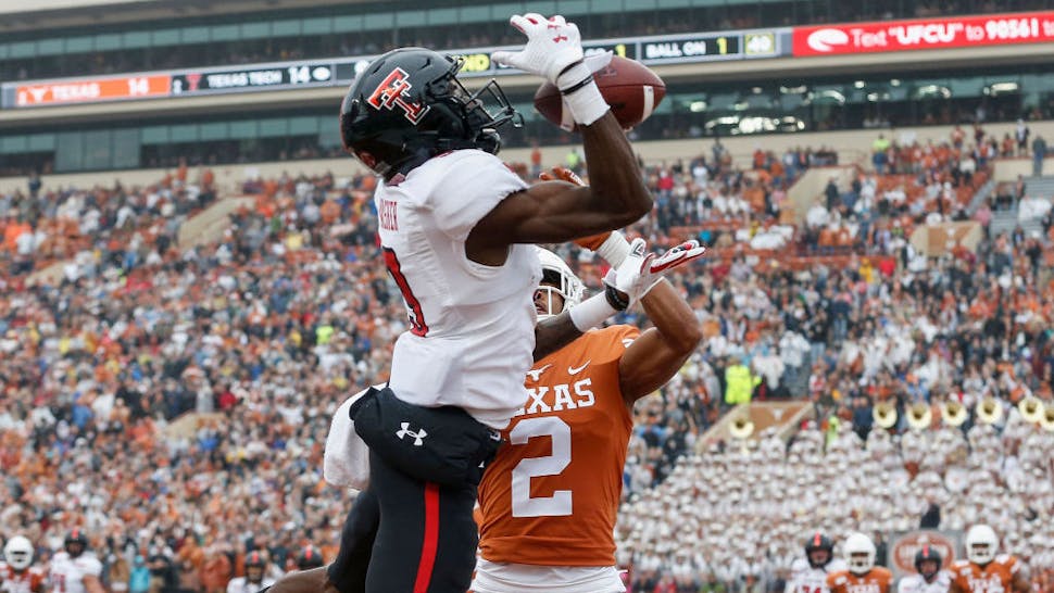 AUSTIN, TX - NOVEMBER 29: Kenyatta Watson II #2 of the Texas Longhorns breaks up a pass in the end zone intended for T.J. Vasher #9 of the Texas Tech Red Raiders in the second quarter at Darrell K Royal-Texas Memorial Stadium on November 29, 2019 in Austin, Texas. (Photo by Tim Warner/Getty Images)