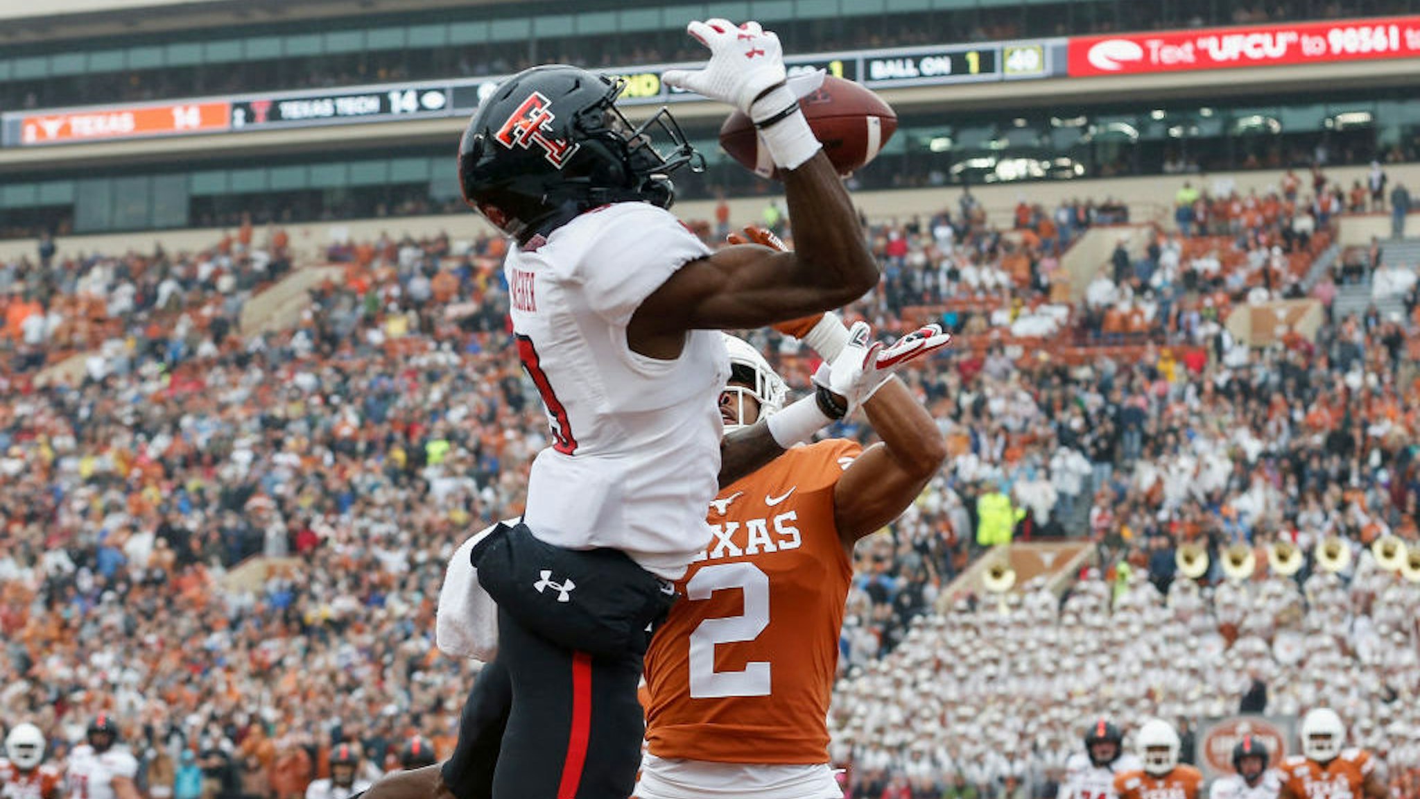 AUSTIN, TX - NOVEMBER 29: Kenyatta Watson II #2 of the Texas Longhorns breaks up a pass in the end zone intended for T.J. Vasher #9 of the Texas Tech Red Raiders in the second quarter at Darrell K Royal-Texas Memorial Stadium on November 29, 2019 in Austin, Texas. (Photo by Tim Warner/Getty Images)