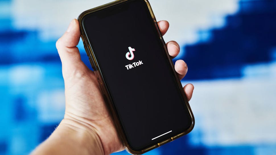 Signage for ByteDance Ltd.'s TikTok app is displayed on a smartphone in an arranged photograph taken in the Brooklyn borough of New York, U.S., on Tuesday, June 30, 2020. India's unprecedented decision to ban 59 of China’s largest apps is a warning to China's tech giants, who for years thrived behind a government-imposed Great Firewall that kept out many of America’s best-known internet names.