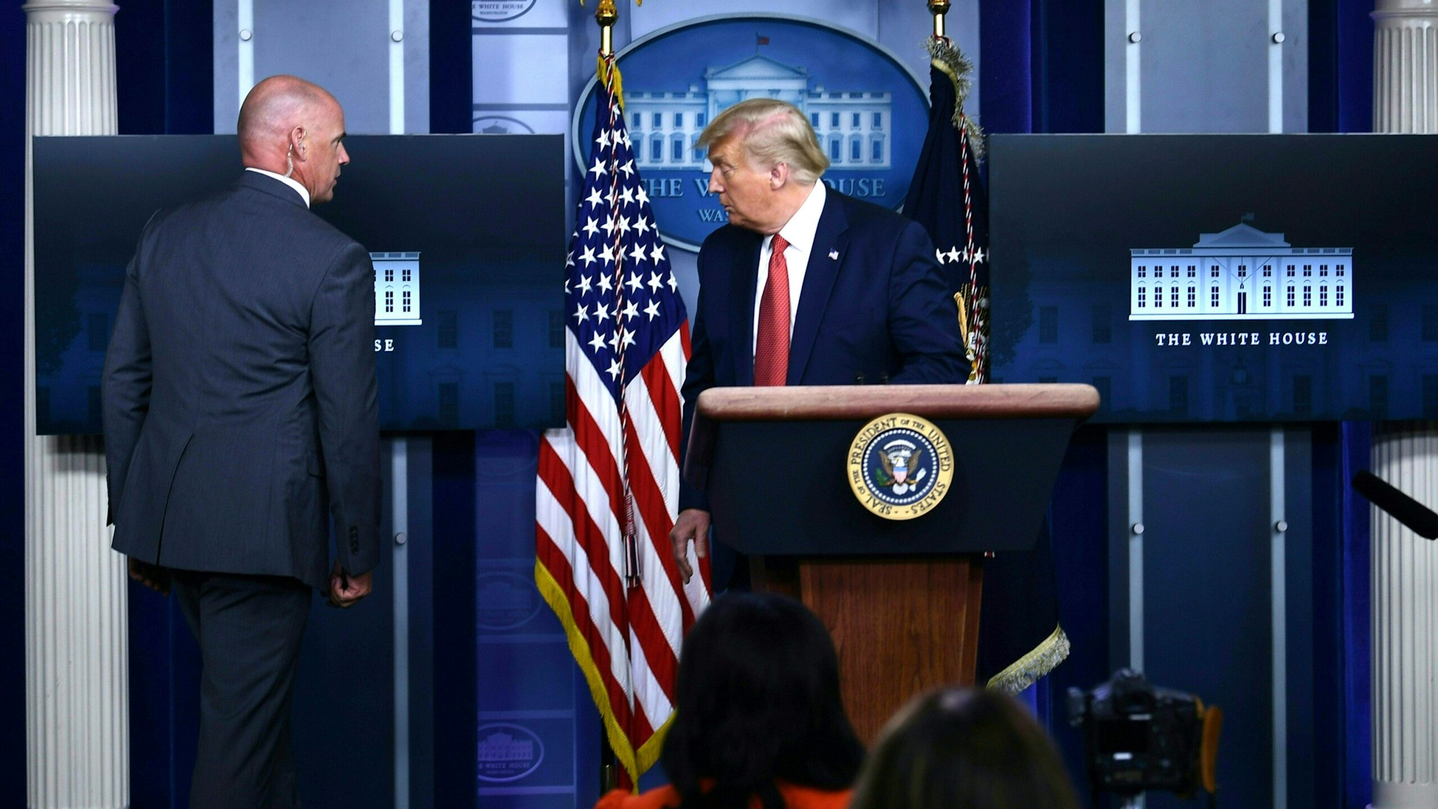 US President Donald Trump is being removed from the Brady Briefing Room of the White House in Washington, DC, on August 10, 2020.