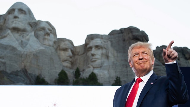 US President Donald Trump gestures as he arrives for the Independence Day events at Mount Rushmore National Memorial in Keystone, South Dakota, July 3, 2020.