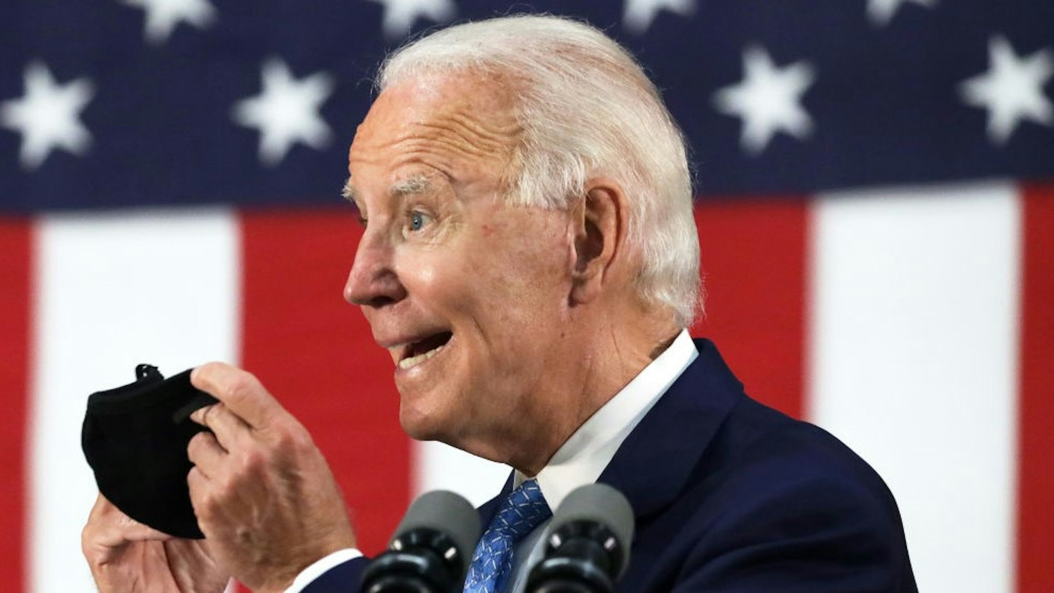 WILMINGTON, DELAWARE - JUNE 30: Democratic presidential candidate, former Vice President Joe Biden holds up a mask as he speaks during a campaign event June 30, 2020 at Alexis I. Dupont High School in Wilmington, Delaware. Biden discussed the Trump Administration’s handling of the COVID-19 pandemic. (Photo by