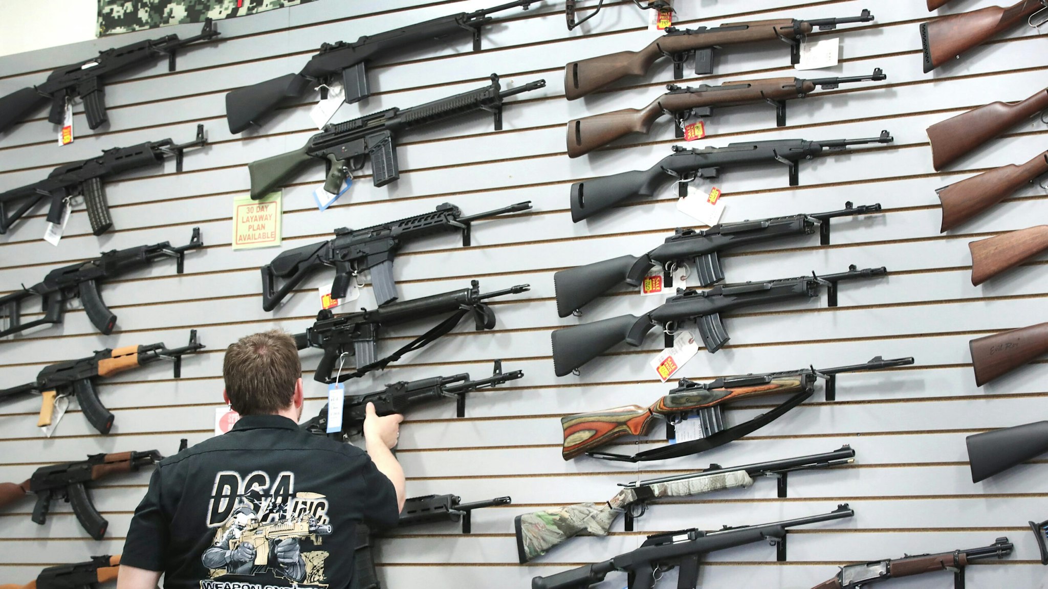 LAKE BARRINGTON, IL - JUNE 17: Guns built by DSA Inc and other manufacturers are displayed inside the DSA Inc. store on June 17, 2016 in Lake Barrington, Illinois. Earlier in the day the facility was the target of an anti gun protest. DSA Inc. manufactures FAL, AR-15 and RPD rifles.