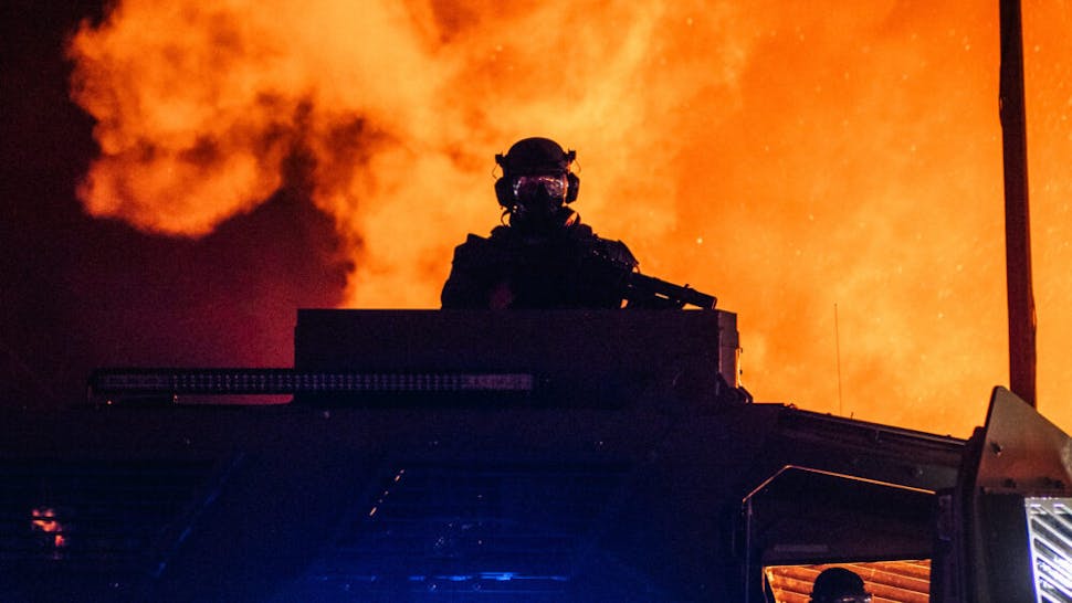 Protests Erupt After Kenosha, WI Police Shoot Black Man 7 Times In The Back Police officers sit in a police patrol vehicle on August 24, 2020 in Kenosha, Wisconsin. This is the second night of rioting after the shooting of Jacob Blake, 29, on August 23. Blake was shot multiple times in the back by Wisconsin police officers after attempting to enter into the drivers side of a vehicle.