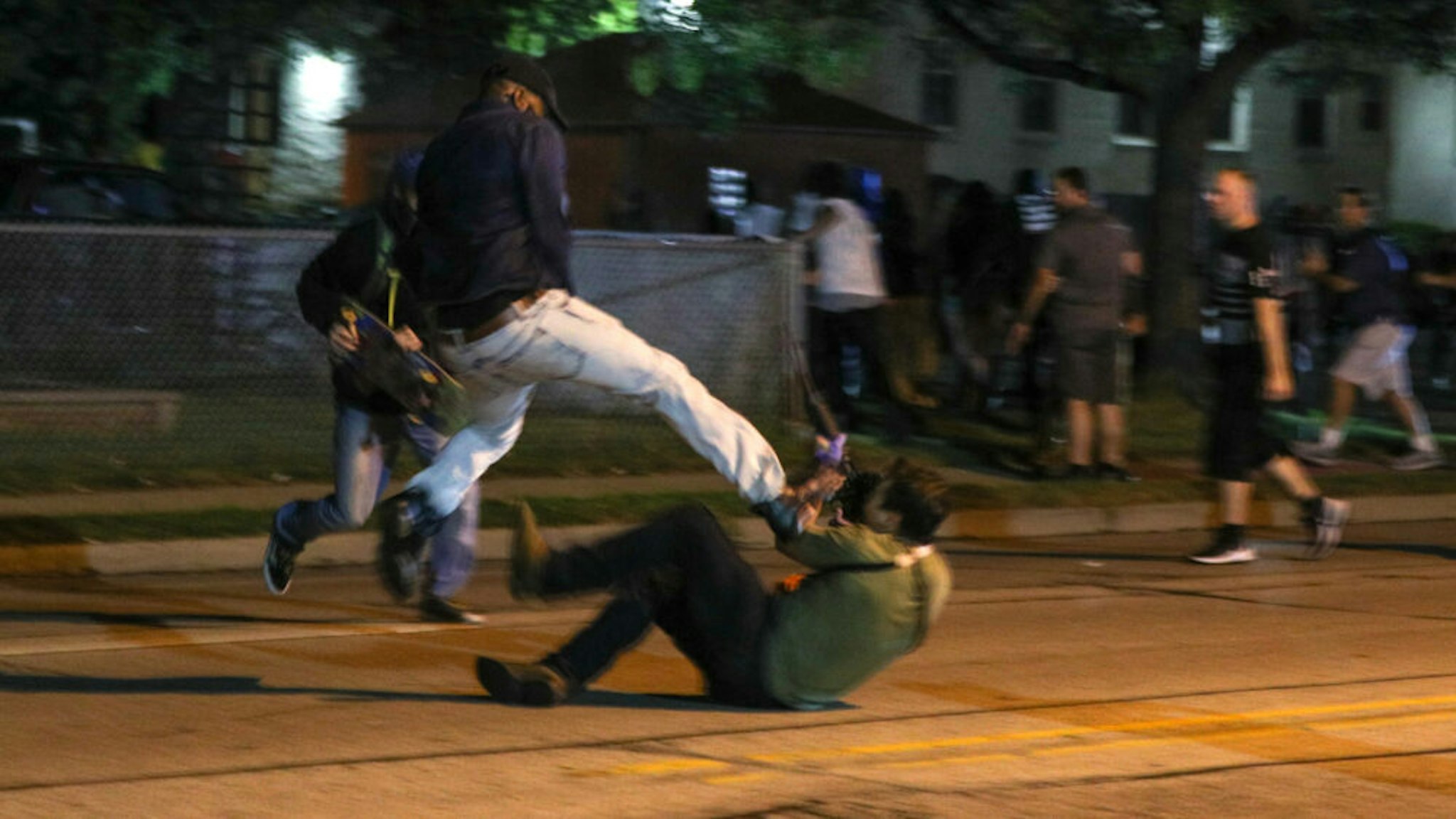 Clashes between protesters and armed civilians, who protect the streets of Kenosha against the arson, break out during the third day of protests over the shooting of a black man Jacob Blake by police officer in Wisconsin, United States on August 25, 2020.