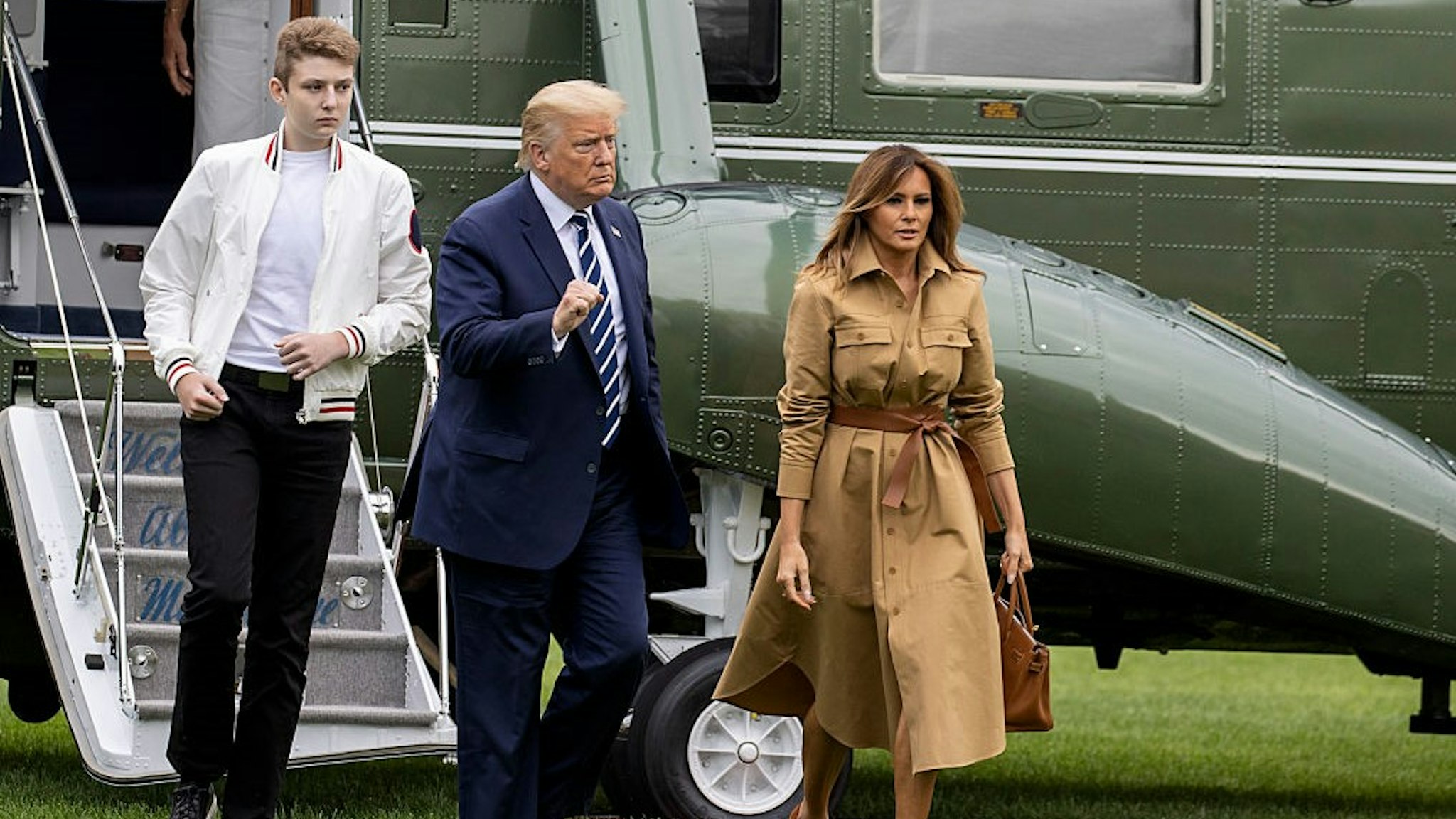 WASHINGTON, DC - AUGUST 16: Barron Trump, US President Donald Trump and First lady Melania Trump walk on the South Lawn of the White House on August 16, 2020 in Washington, DC. Robert Trump, 71, the younger brother of the president, died Saturday in Manhattan. (Photo by
