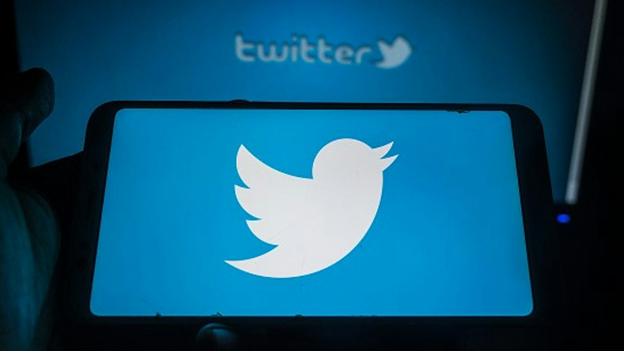 Twitter logo displayed on a phone screen in Tehatta, Nadia, West Bengal, India on June 16, 2020. Twitter is launching two new features: The ability to save a tweet as a draft, as well as the ability to schedule a tweet to send at a specific time. (Photo Illustation by