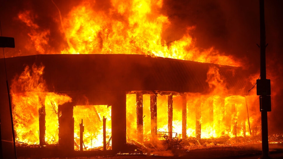 Jacob Blake protesters lit buildings on fire in Kenosha, Wisconsin, United States on August 24, 2020. A police shooting in the US state of Wisconsin sent a Black man into serious condition on Sunday, with the video footage of the incident triggering outrage.