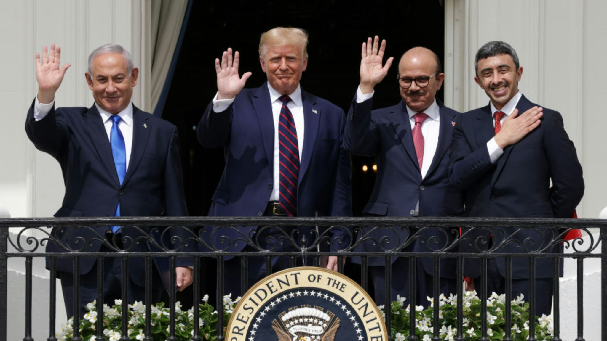 Prime Minister of Israel Benjamin Netanyahu, U.S. President Donald Trump, Foreign Affairs Minister of Bahrain Abdullatif bin Rashid Al Zayani, and Foreign Affairs Minister of the United Arab Emirates Abdullah bin Zayed bin Sultan Al Nahyan wave from the Truman Balcony of the White House after the signing ceremony of the Abraham Accords on the South Lawn of the White House on September 15, 2020 in Washington, DC.