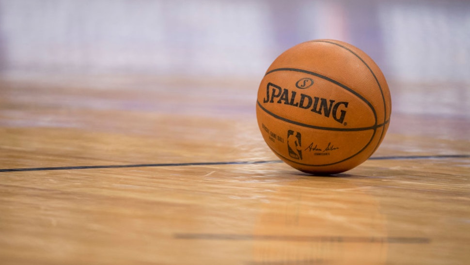 The official game ball sits on the court during the game between the Denver Nuggets and the LA Clippers at Pepsi Center on February 27, 2018 in Denver, Colorado.