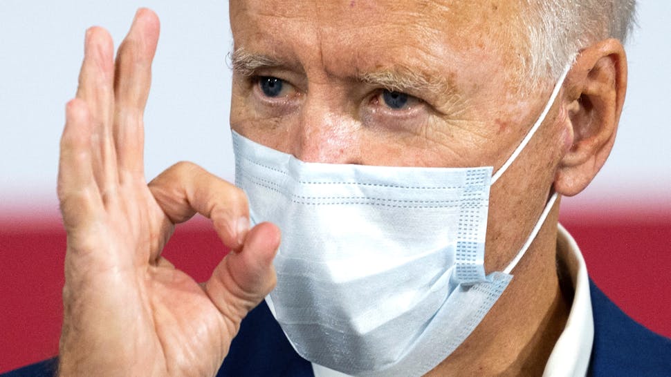 Democratic Presidential Candidate Joe Biden makes a zero with his hand as he delivers remarks at an aluminum manufacturing facility in Manitowoc, Wisconsin, on September 21, 2020.