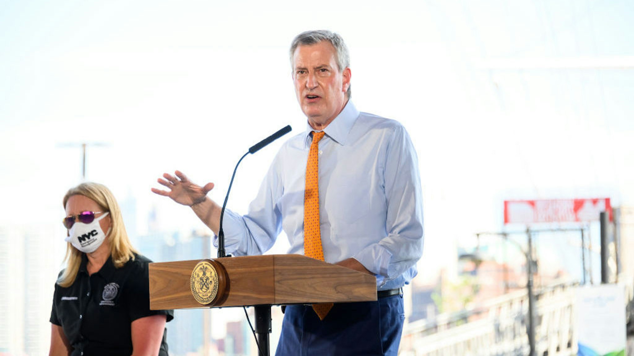 NEW YORK, NEW YORK - AUGUST 03: New York City Mayor Bill de Blasio speaks at South Street Seaport as workers erect temporary flood barriers in preparation for potential flooding and a storm surge from Tropical Storm Isaias on August 03, 2020 in New York City. The storm, which is heading up the East Coast packing heavy winds, is expected to dump several inches of rain on the metro area starting late this evening and into tomorrow. The interlocking tubes, called Tiger Dams, are installed in areas that were heavily damaged from flooding during Hurricane Sandy. (Photo by Noam Galai/Getty Images)