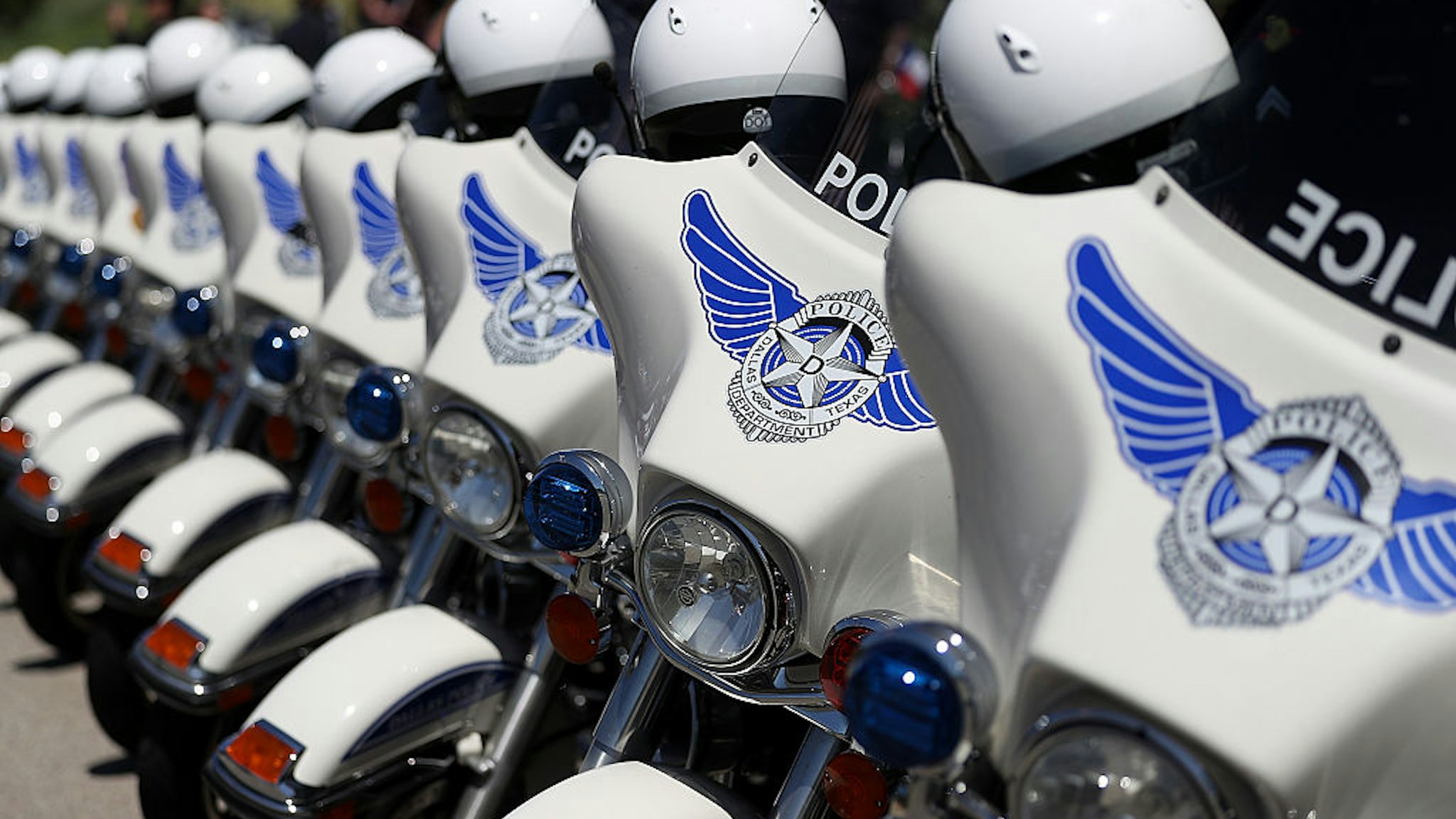 DALLAS, TX - JULY 14: Dallas police motorcycles line up outside of the funeral for slain Dallas police Sgt. Michael Smith at The Watermark Church on July 14, 2016 in Dallas, Texas. Dallas police Sgt. Michael Thomas was one of five Dallas police officers who were shot and killed by a sniper during a Black Lives Matter march in Dallas. (Photo by Justin Sullivan/Getty Images)