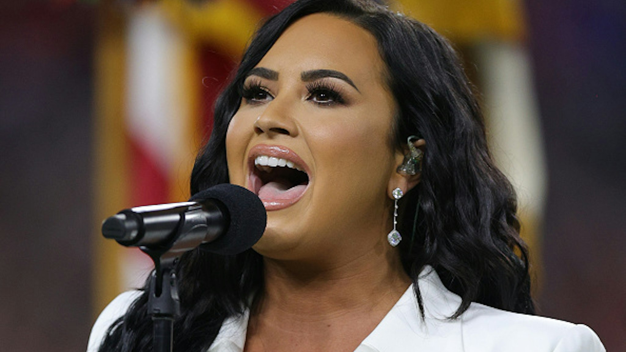 MIAMI, FLORIDA - FEBRUARY 02: Singer Demi Lovato performs the national anthem prior to Super Bowl LIV between the San Francisco 49ers and the Kansas City Chiefs at Hard Rock Stadium on February 02, 2020 in Miami, Florida.
