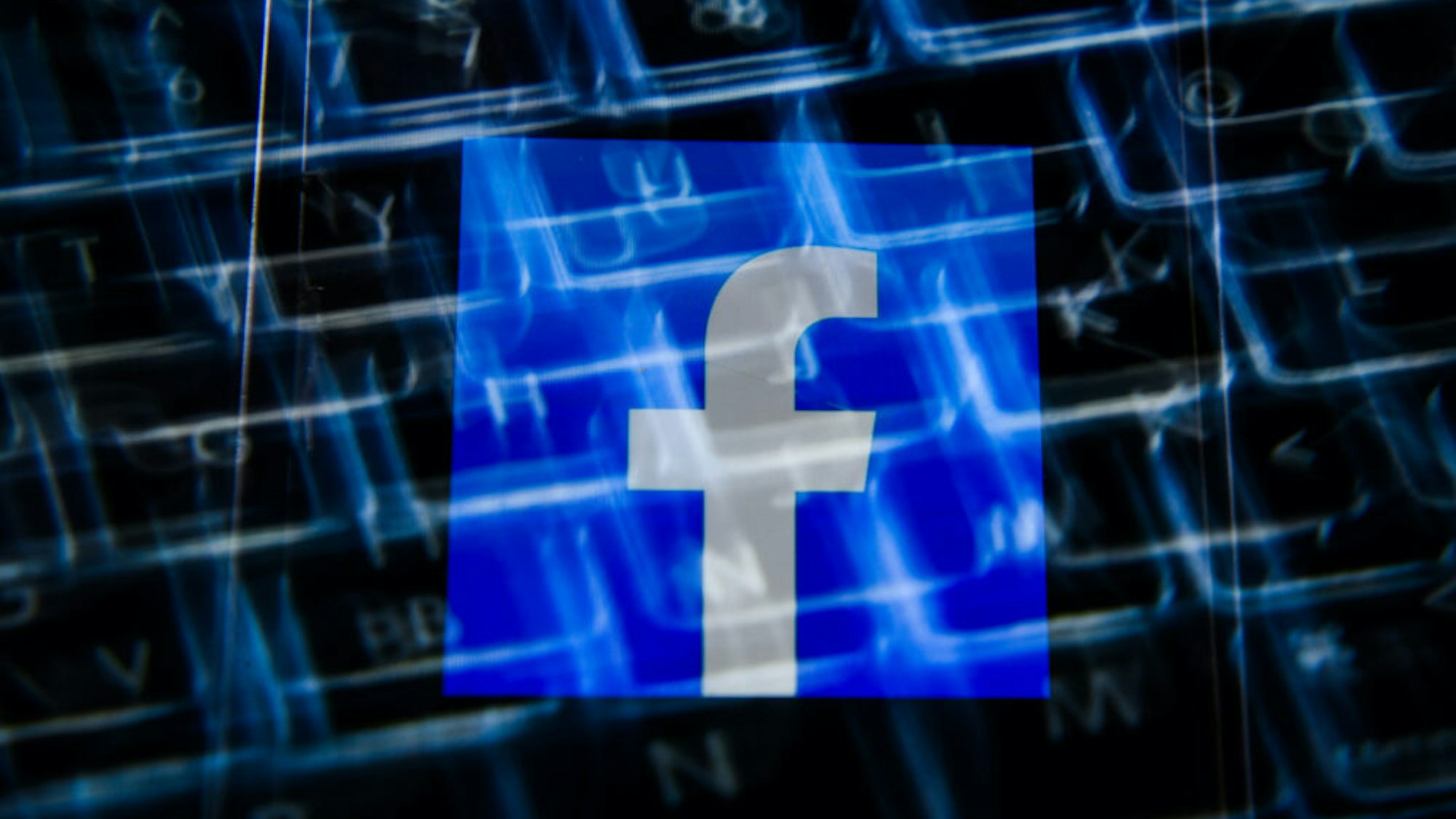 In this photo illustration a Facebook logo seen displayed on a smartphone with a laptop keyboard in the background. (Photo Illustration by Omar Marques/SOPA Images/LightRocket via Getty Images)