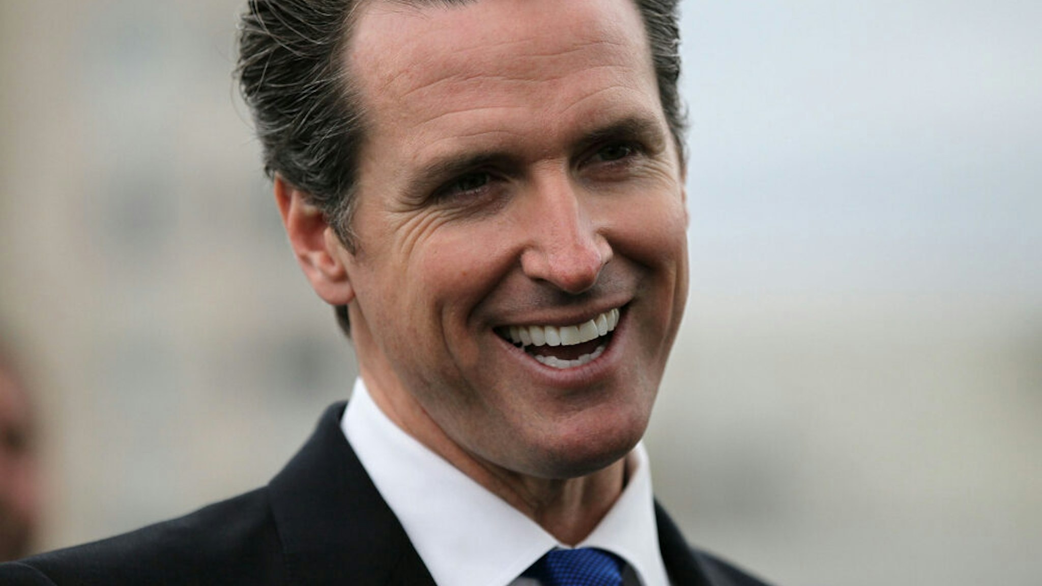 SAN FRANCISCO - MAY 25: San Francisco mayor Gavin Newsom smiles during a news conference May 25, 2010 in San Francisco, California. Mayor Newsom signed fee deferment legislation that will stimulate development and and generate construction jobs by allowing developers to defer upfront city development impact fees.