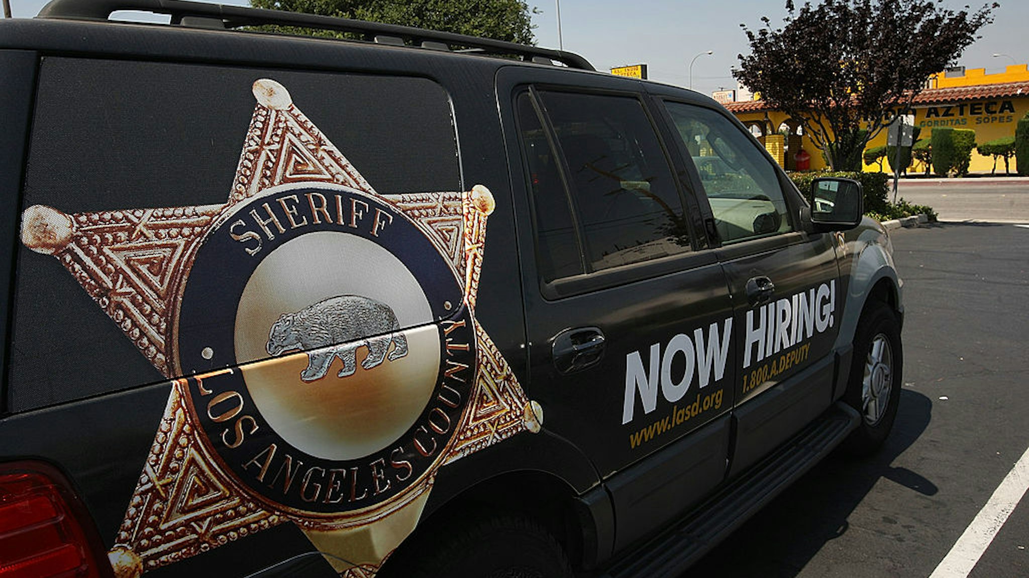 MAYWOOD, CA - JUNE 23: Los Angeles County sheriffs vehicle that advertises for recruits is parked in the parking lot of the Maywood police department as sheriffs deputies make plans to take over the facility on June 23, 2010 in Maywood, California. Facing a $450,000 budget deficit, the Maywood City Council approved the most drastic action yet of any California city to wrest control of its fiscal crisis by firing all its employees, disbanding its police department and contracting out its entire municipal operations to a neighboring city. County sheriffs will replace Maywood police officers but council members will remain on the payroll to set policy. (Photo by David McNew/Getty Images)
