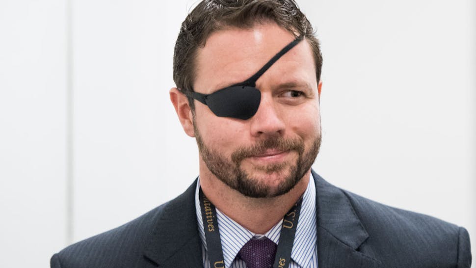 Rep.-elect Dan Crenshaw Rep.-elect Dan Crenshaw, R-Texas, arrives for the House Republican leadership elections forum in the Capitol on Tuesday, Nov. 13, 2018.