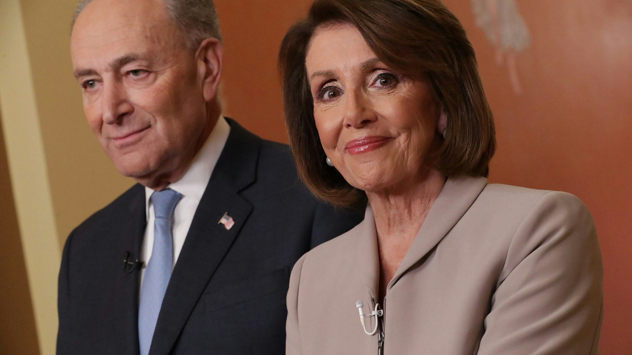 Speaker of the House Nancy Pelosi (D-CA) and Senate Minority Leader Charles Schumer (D-NY) pose for photographs after delivering a televised response to President Donald Trump's national address about border security at the U.S. Capitol January 08, 2019 in Washington, DC. Republicans and Democrats seem no closer to an agreement on security along the southern border and ending the partial federal government shutdown, the second-longest in history.