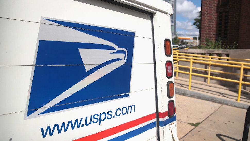 CHICAGO, ILLINOIS - AUGUST 15: A United States Postal Service (USPS) truck leaves a postal facility on August 15, 2019 in Chicago, Illinois. In its recent quarterly statement the USPS reported a loss of nearly $2.3 billion and a 3.2 percent decline in package deliveries, the first decline in nearly a decade. (Photo by Scott Olson/Getty Images)