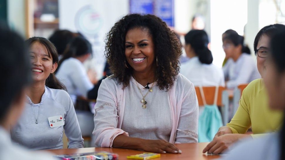 Former US First Lady Michelle Obama meets Vietnamese students in Can Giuoc district, Long An province on December 9, 2019. - Michelle Obama and Julia Roberts visit to promote girls' education in Vietnam. (Photo by Nhac NGUYEN / AFP) (Photo by NHAC NGUYEN/AFP via Getty Images)
