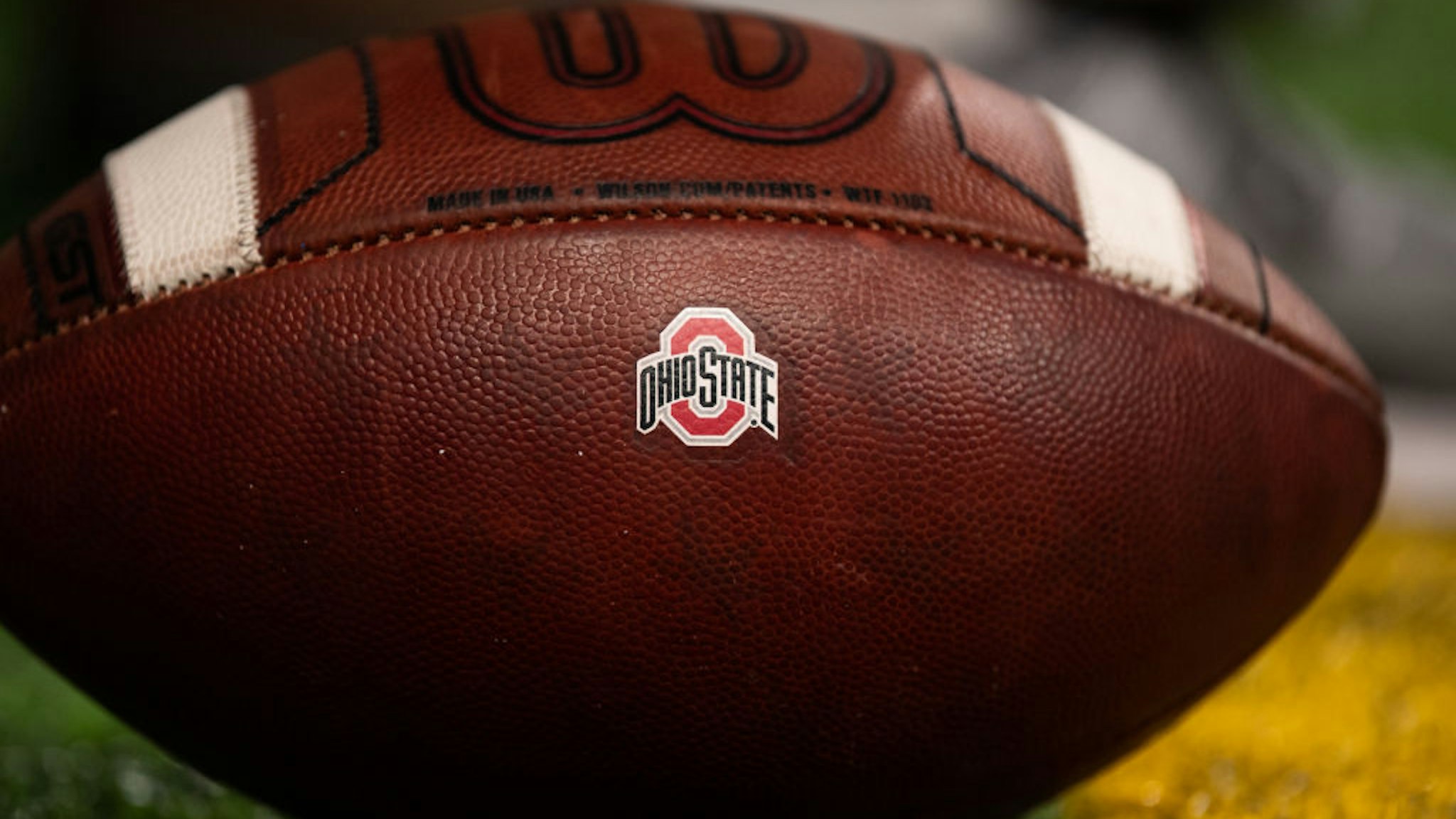 INDIANAPOLIS, IN - DECEMBER 07: A NCAA football with the Ohio State Buckeyes logo on it during the Big 10 Championship game between the Wisconsin Badgers and Ohio State Buckeyes on December 7, 2019, at Lucas Oil Stadium in Indianapolis, IN. (Photo by Zach Bolinger/Icon Sportswire via Getty Images)