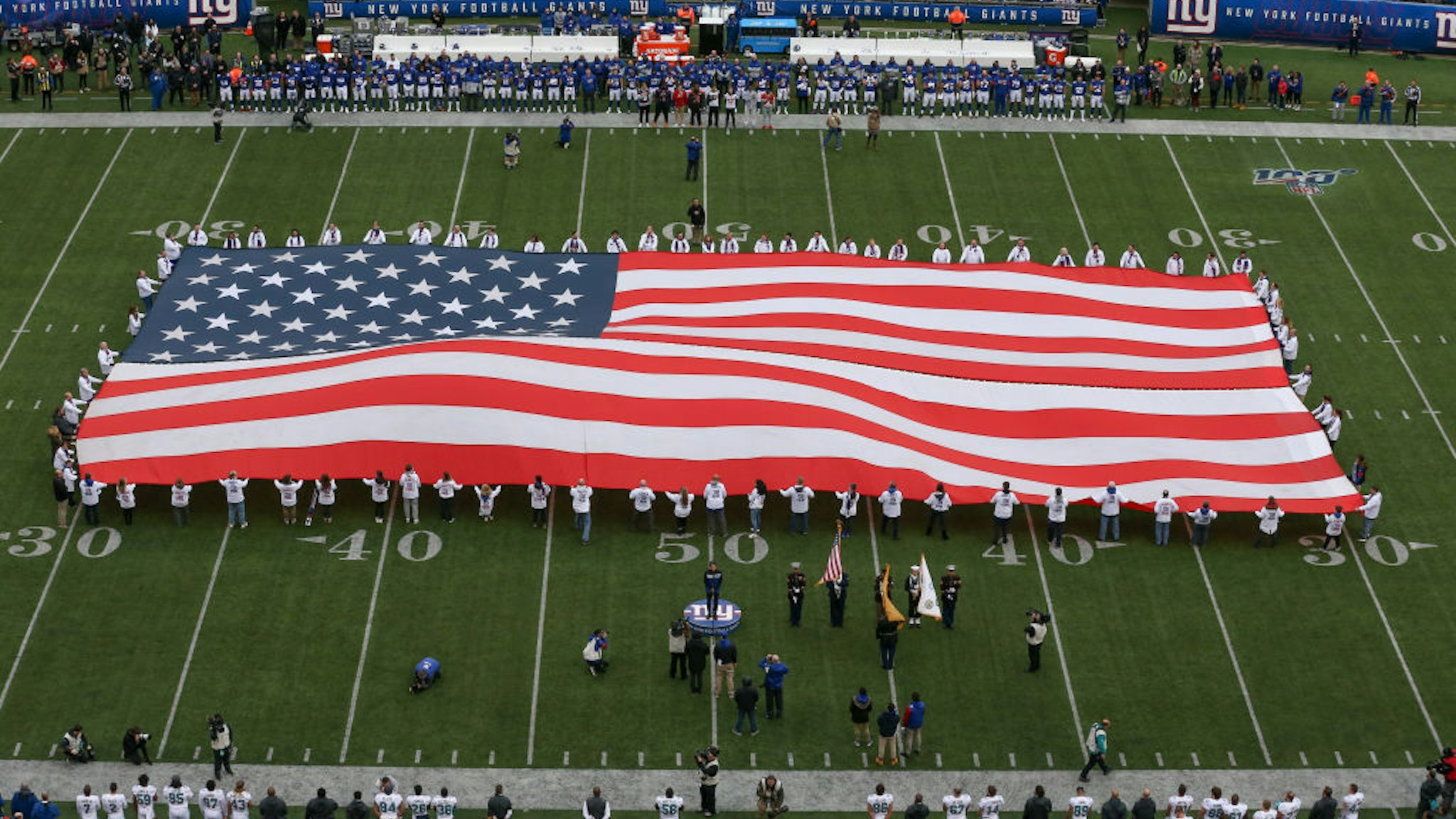 A general view of a large American Flag on the field prior to the National Football League game between the New York Giants and the Miami Dolphins on December 15, 2019 at MetLife Stadium in East Rutherford, NJ.