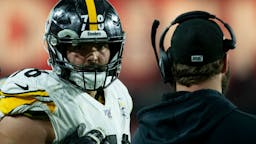 Alejandro Villanueva Offensive tackle Alejandro Villanueva #78 of the Pittsburgh Steelers talks with quarterback Ben Roethlisberger #7 on the sidelines of the game against the Arizona Cardinals at State Farm Stadium on December 08, 2019 in Glendale, Arizona.