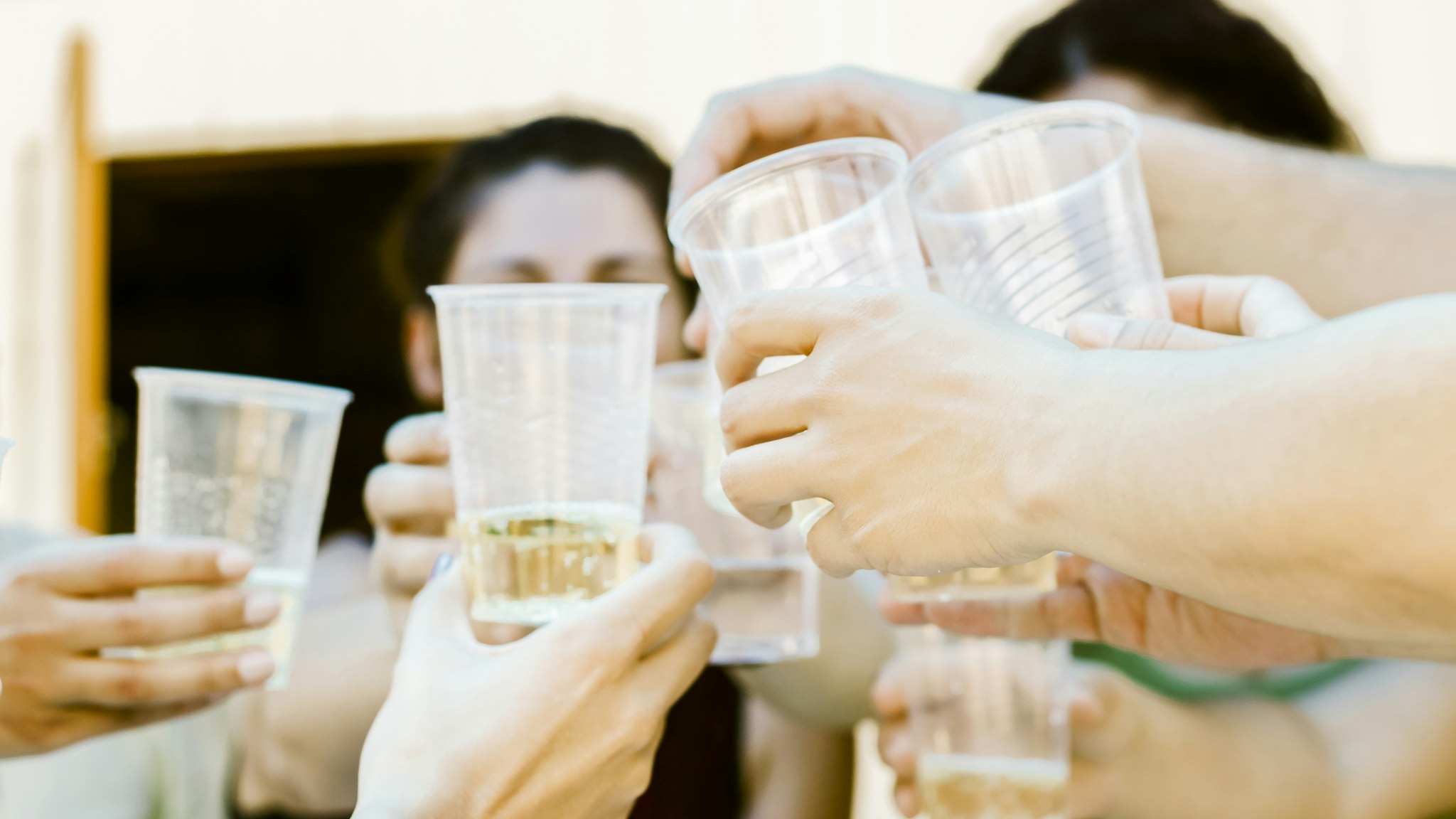 Group of people hands toasting - stock photo