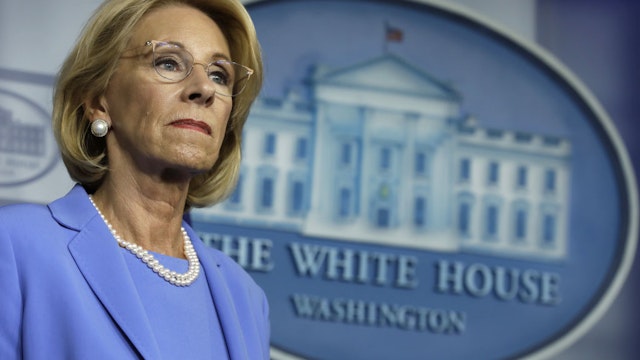 Betsy DeVos, U.S. secretary of education, listens during a Coronavirus Task Force news conference at the White House in Washington, D.C., U.S., on Friday, March 27, 2020.