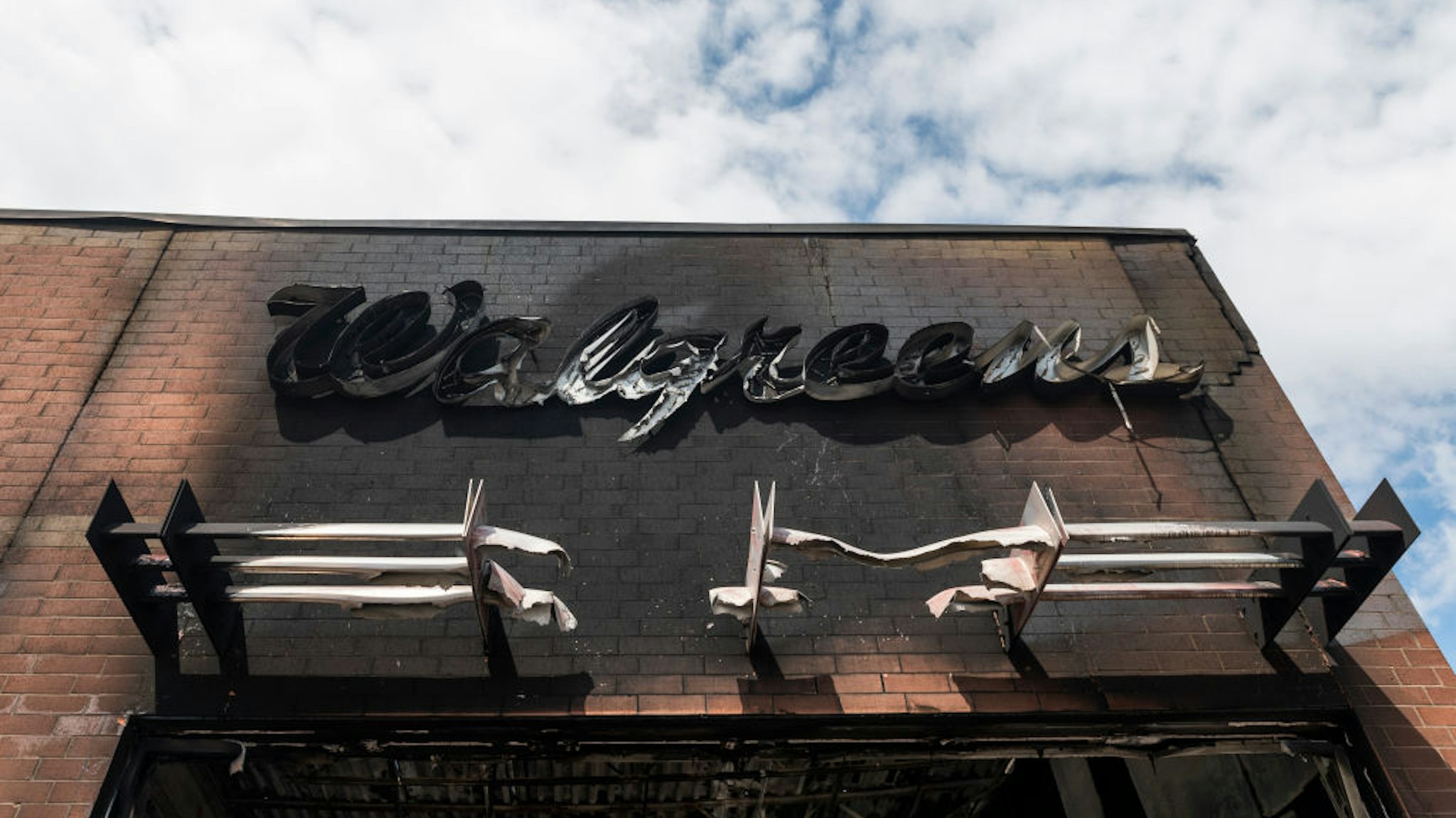 A view outside a burned Walgreens store on May 30, 2020 in Minneapolis, Minnesota. Buildings and businesses around the Twin Cities have been looted and destroyed in the fallout after the death of George Floyd while in police custody.