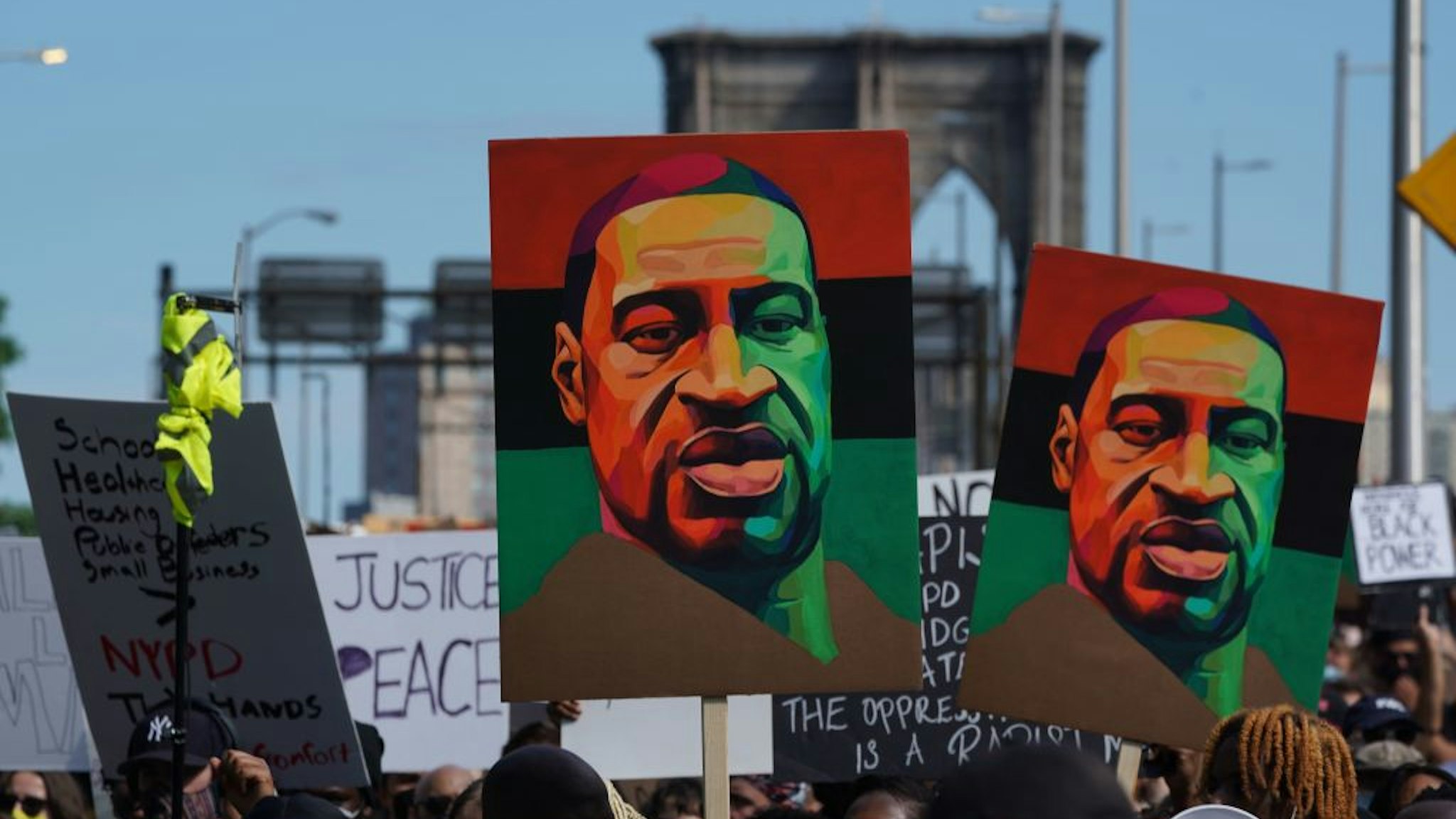 TOPSHOT - Protesters march across the Brooklyn Bridge over the death of George Floyd by Minneapolis Police during a Juneteenth rally in New York on June 19, 2020. - The US marks the end of slavery by celebrating Juneteenth, with the annual unofficial holiday taking on renewed significance as millions of Americans confront the nation's living legacy of racial injustice. (Photo by Bryan R. Smith / AFP) (Photo by BRYAN R. SMITH/AFP via Getty Images)