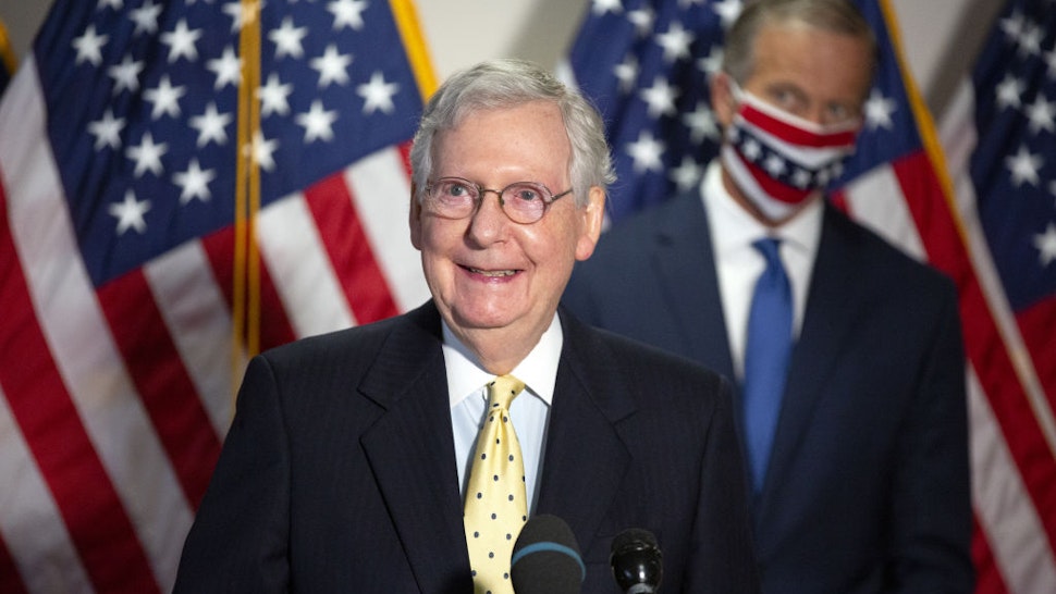 Senate Majority Leader Mitch McConnell, a Republican from Kentucky, left, speaks during a news conference following the Senate Republican policy luncheon on Capitol Hill in Washington, D.C., U.S., on Tuesday, July 21, 2020.
