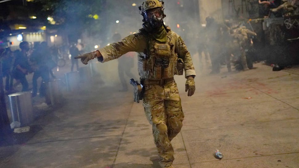 oregon state police ORTLAND, OR - JULY 21:A federal officer tells the crowd to move while dispersing a protest in front of the Mark O. Hatfield U.S. Courthouse on July 21, 2020 in Portland, Oregon. State and city elected officials have called for the federal officers to leave Portland as clashes between protesters and federal police continue to escalate. (Photo by Nathan Howard/Getty Images)