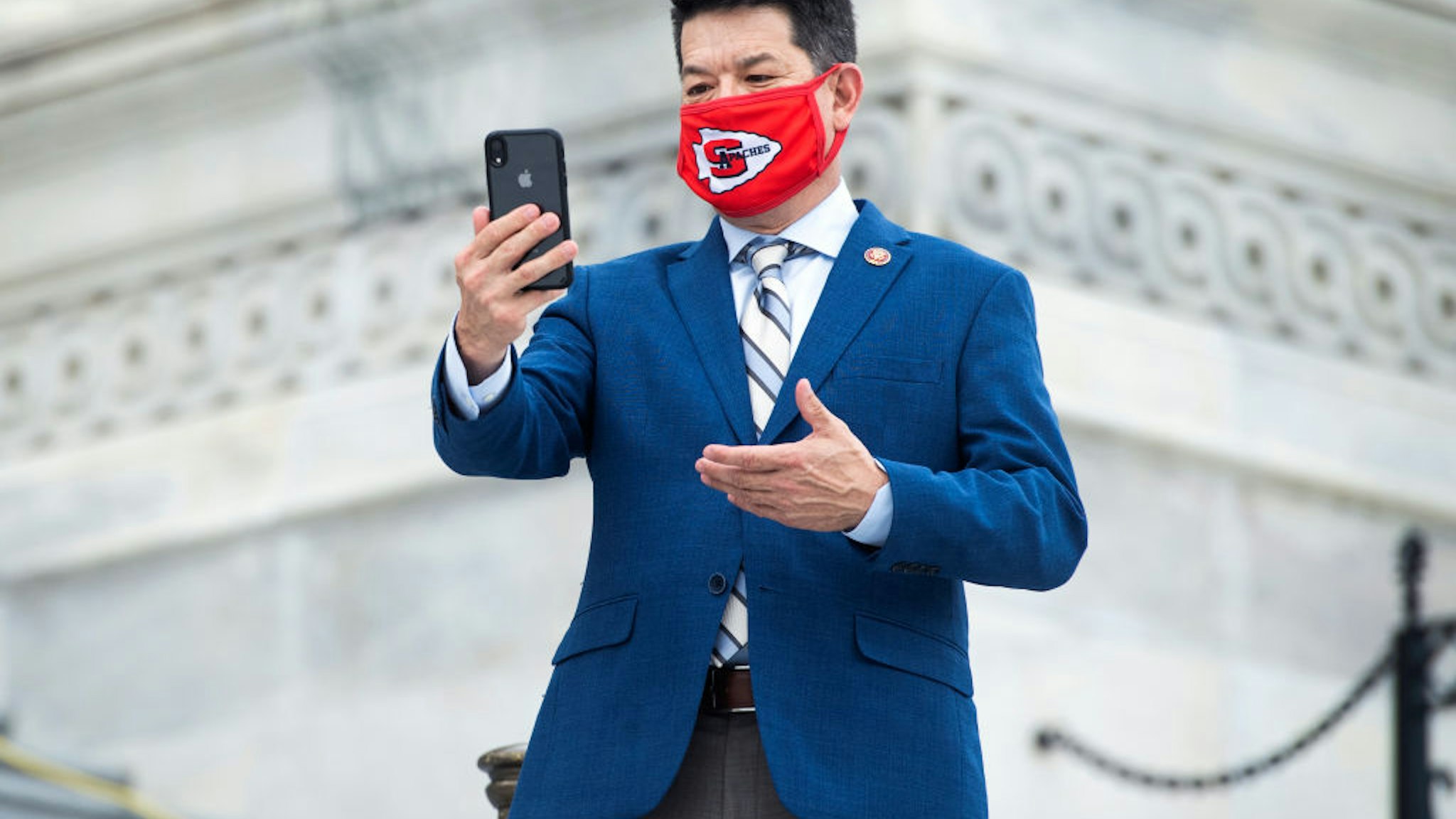 Rep. T.J. Cox, D-Calif., films a message outside the Capitol as the House voted on a bill to ban changes to U.S. Postal Service operations and provide $25 billion in funding on Saturday, August 22, 2020.