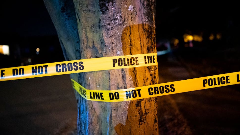 portland shooting PORTLAND, OR - AUGUST 28: A Portland police officer cordons off a street during an investigation of gunfire near a protest on August 26, 2020 in Portland, Oregon. No injuries were reported following two shootings that occurred within blocks of the nightly protests Friday.