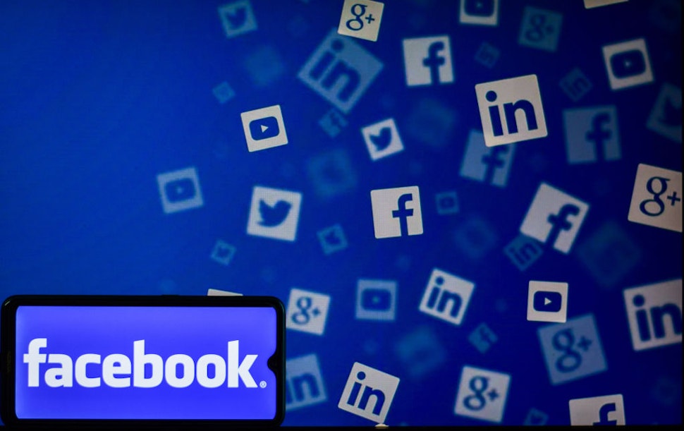 In this photo illustration a Facebook Logo seen displayed on a smartphone.