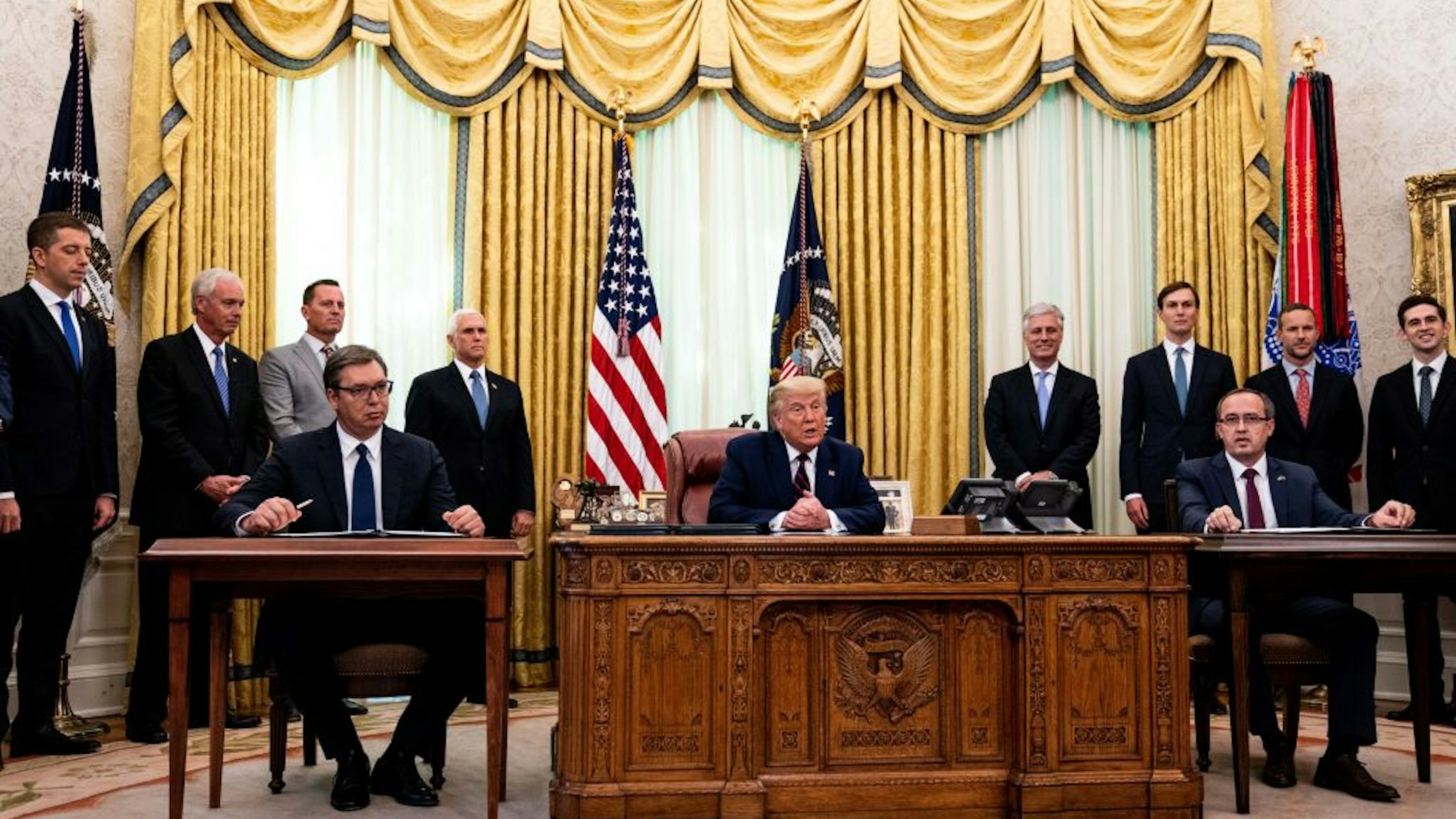 U.S. President Donald Trump (C) participates in a signing ceremony and meeting with the President of Serbia Aleksandar Vucic (L) and the Prime Minister of Kosovo Avdullah Hoti (R) in the Oval Office of the White House on September 4, 2020 in Washington, DC.