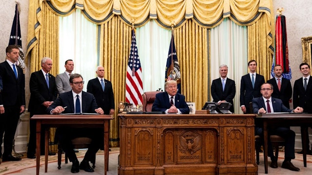 U.S. President Donald Trump (C) participates in a signing ceremony and meeting with the President of Serbia Aleksandar Vucic (L) and the Prime Minister of Kosovo Avdullah Hoti (R) in the Oval Office of the White House on September 4, 2020 in Washington, DC.