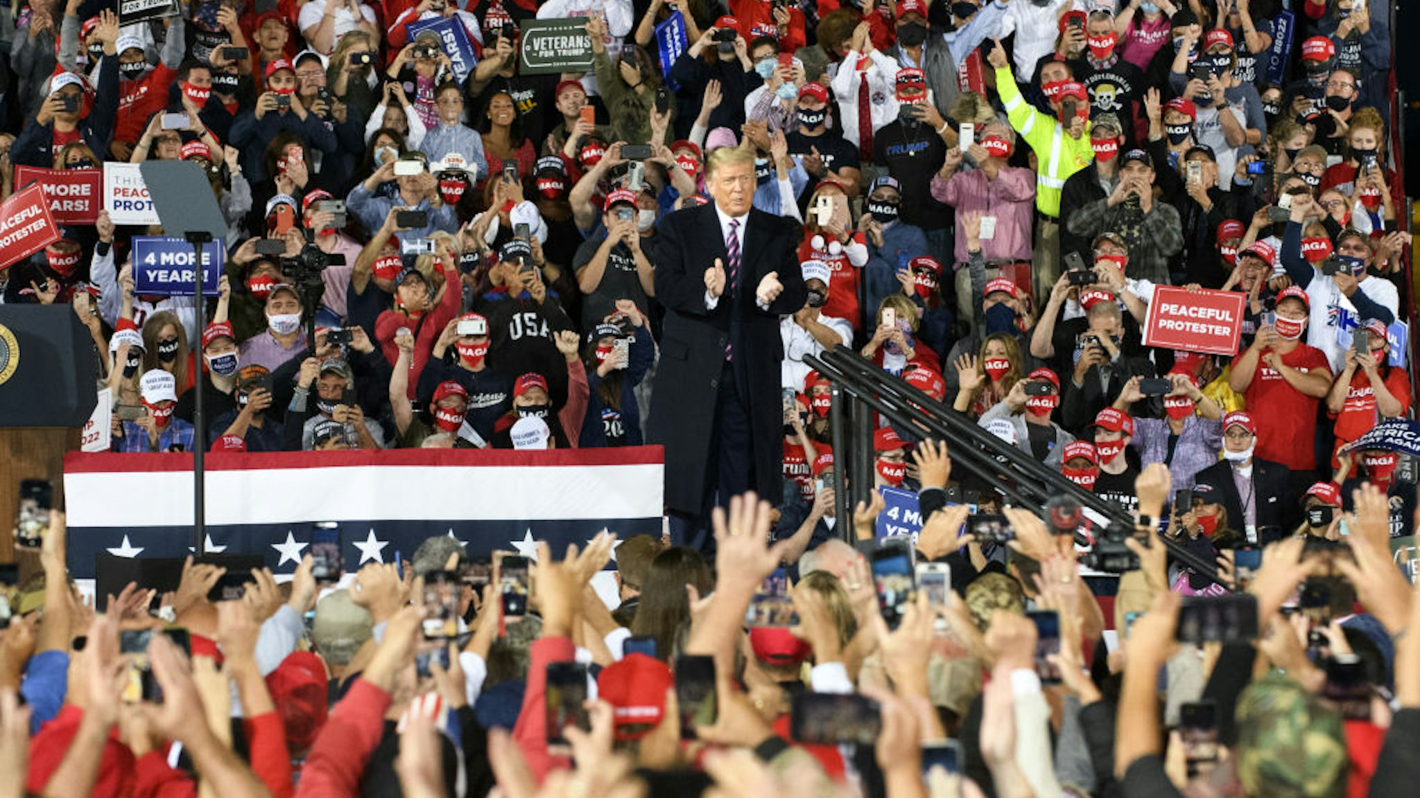 U.S. President Donald Trump claps during a 'Make America Great Again' campaign rally in Moon Township, Pennsylvania, U.S., on Tuesday, Sept. 22, 2020.