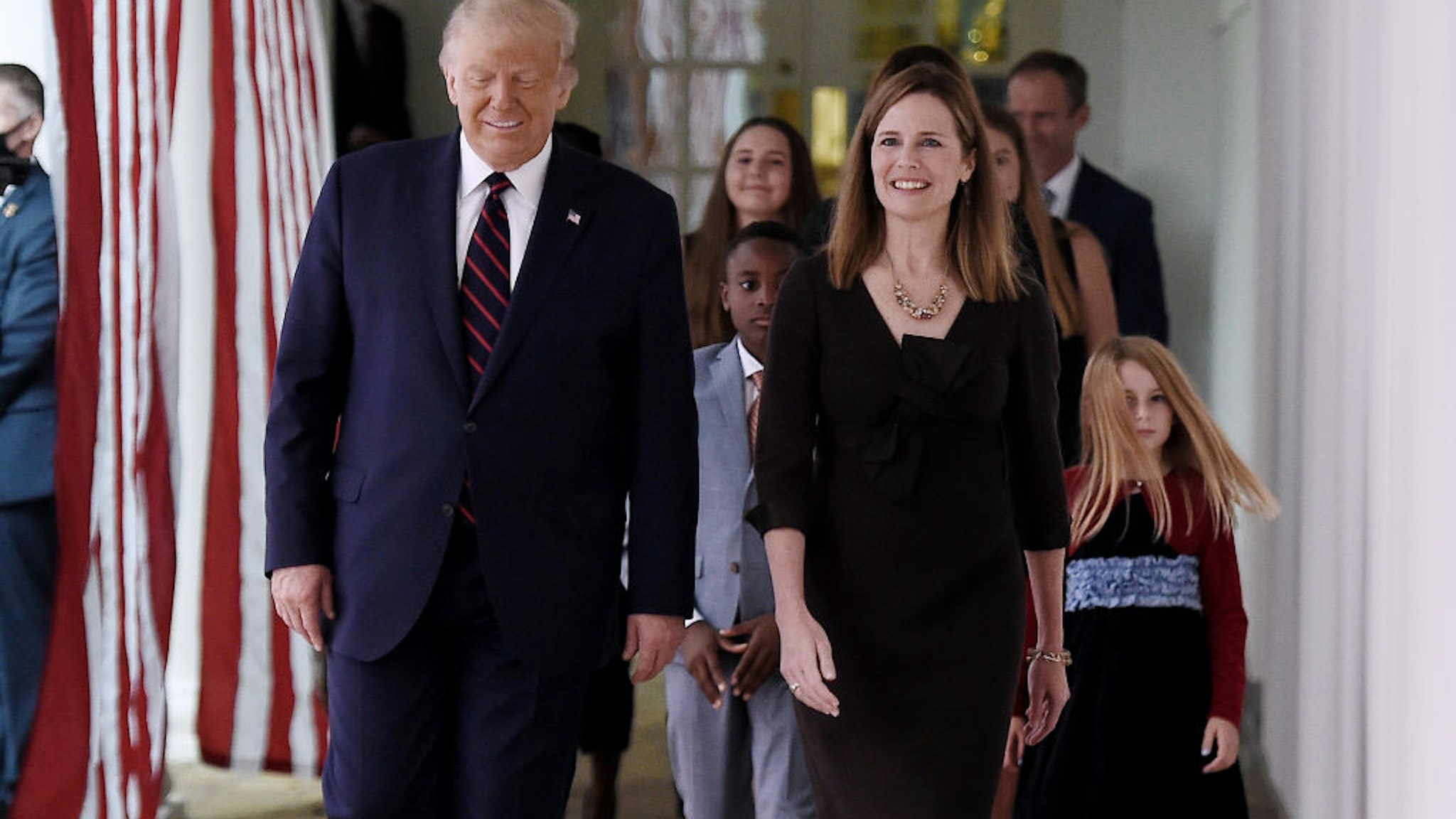 S President Donald Trump (L) and Judge Amy Coney Barrett (R), arrive at the Rose Garden of the White House in Washington, DC, on September 26, 2020. - Judge Amy Coney Barrett, who was nominated Saturday to the US Supreme Court, is a darling of conservatives for her religious views but detractors warn her confirmation would shift the nation's top court firmly to the right. (Photo by Olivier DOULIERY / AFP) (Photo by OLIVIER DOULIERY/AFP via Getty Images)