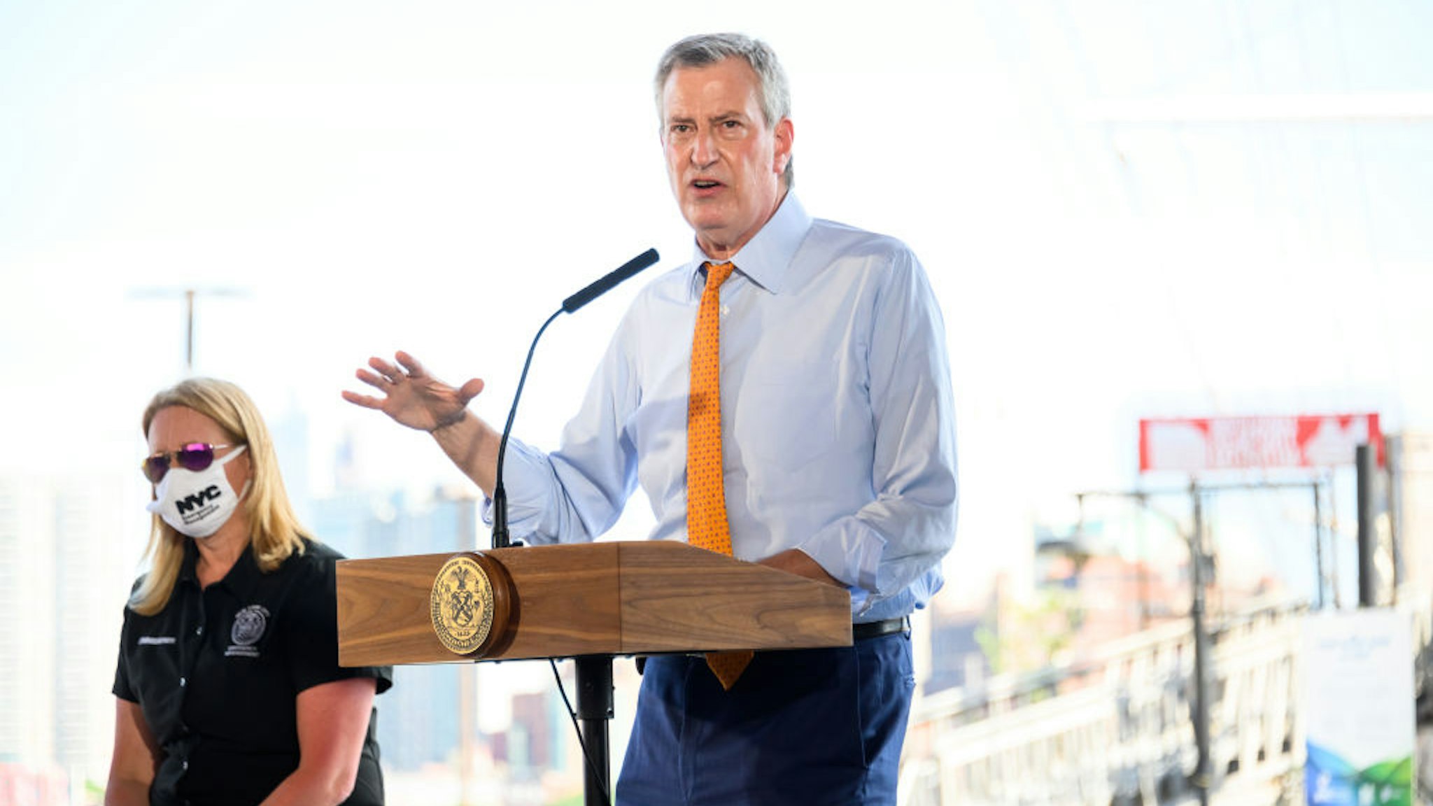 NEW YORK, NEW YORK - AUGUST 03: New York City Mayor Bill de Blasio speaks at South Street Seaport as workers erect temporary flood barriers in preparation for potential flooding and a storm surge from Tropical Storm Isaias on August 03, 2020 in New York City. The storm, which is heading up the East Coast packing heavy winds, is expected to dump several inches of rain on the metro area starting late this evening and into tomorrow. The interlocking tubes, called Tiger Dams, are installed in areas that were heavily damaged from flooding during Hurricane Sandy. (Photo by Noam Galai/Getty Images)