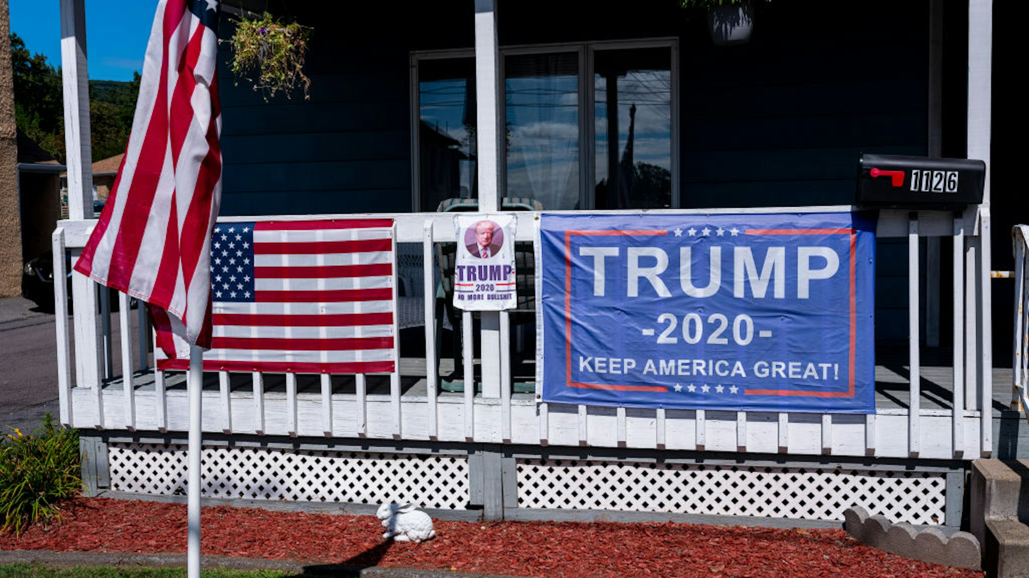 Political posters favoring U.S. presidential candidate President Donald Trump are attached to a railing September 11, 2020 in Scranton, Pennsylvania.