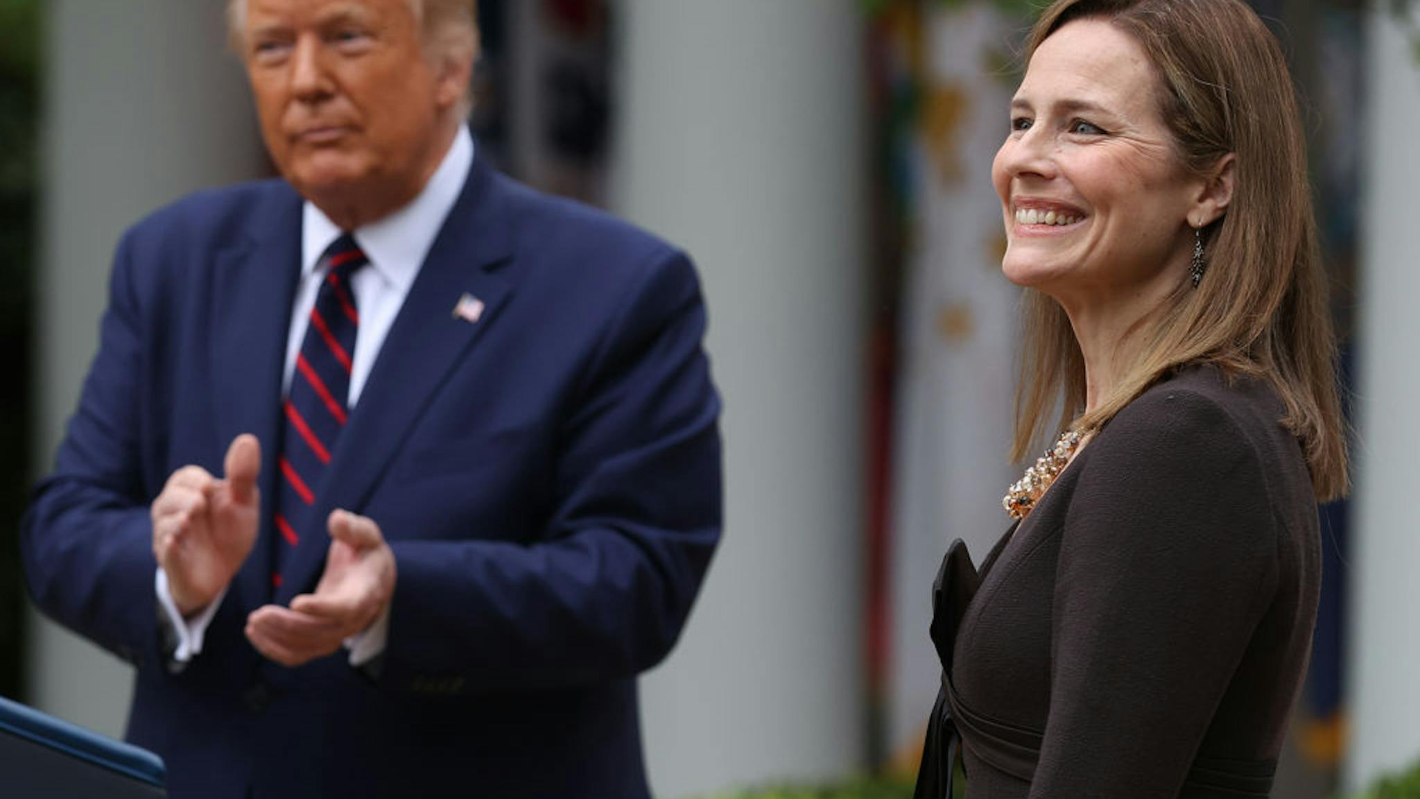 amy coney barrett WASHINGTON, DC - SEPTEMBER 26: U.S. President Donald Trump (L) introduces 7th U.S. Circuit Court Judge Amy Coney Barrett as his nominee to the Supreme Court in the Rose Garden at the White House September 26, 2020 in Washington, DC. With 38 days until the election, Trump tapped Barrett to be his third Supreme Court nominee in just four years and to replace the late Associate Justice Ruth Bader Ginsburg, who will be buried at Arlington National Cemetery on Tuesday. (Photo by Chip Somodevilla/Getty Images) and authorities at his disposal, to aid U.S. farmers, whose financial peril has worsened in the coronavirus pandemic. Photographer: