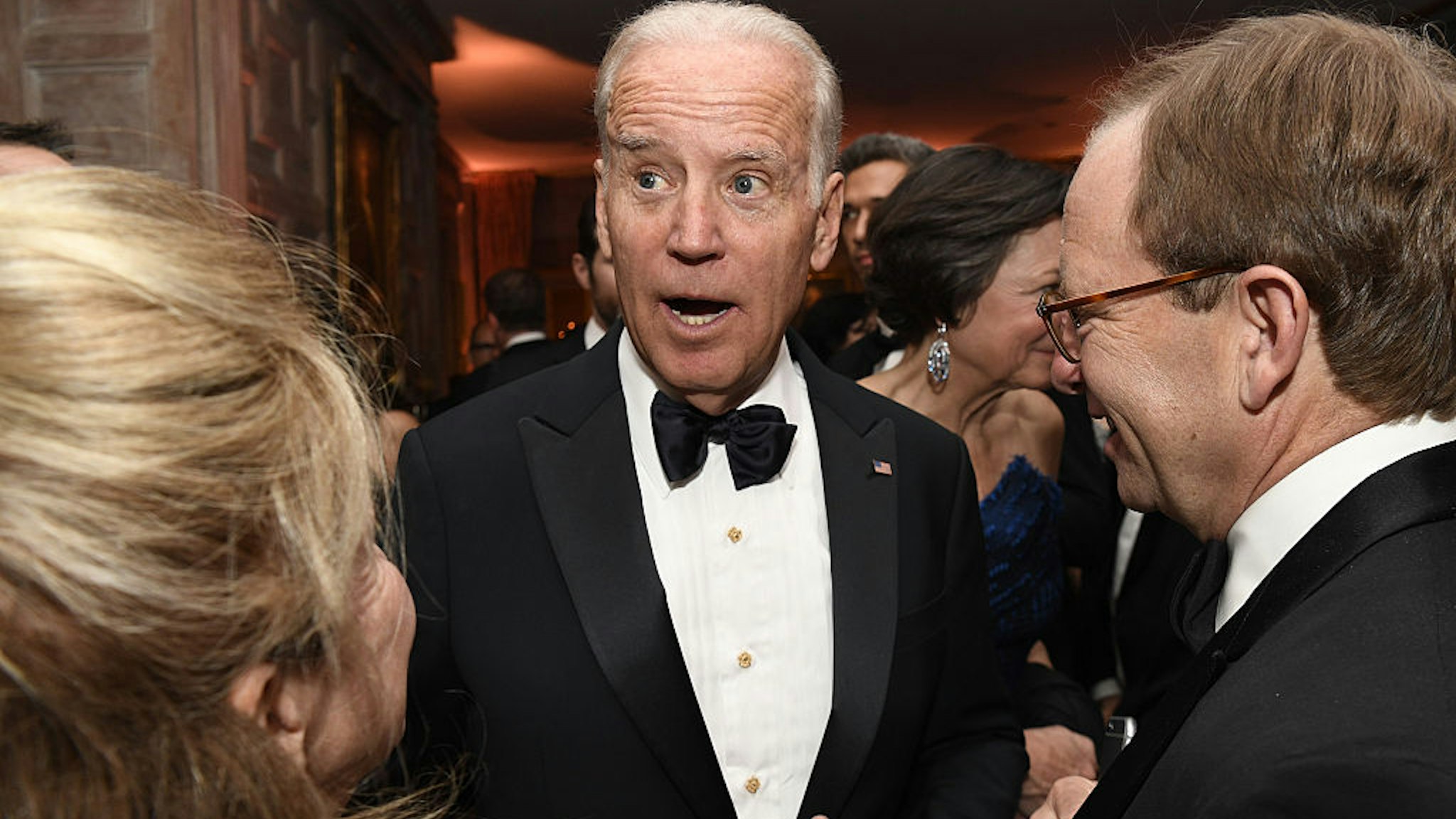 Vice President Joseph "Joe" Biden, center, attends the Bloomberg Vanity Fair White House Correspondents' Association (WHCA) dinner afterparty in Washington, D.C., U.S., on Saturday, April 30, 2016. The 102nd WHCA raises money for scholarships and honors the recipients of the organization's journalism awards. Photographer: David Paul Morris/Bloomberg via Getty Images