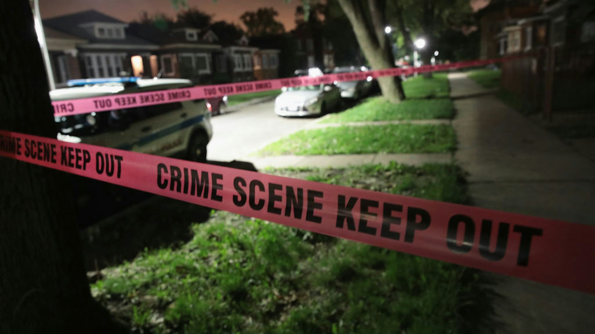 CHICAGO, IL - MAY 27: Crime scene tape is stretched around the front of a home where a man was shot on May 28, 2017 in Chicago, Illinois. Chicago police have added more than 1,000 officers to the streets over the Memorial Day weekend, hoping to put a dent in crime, during what is typically one of the more violent weekends of the year. In 2016, 6 people were killed and another 65 were wounded by gun violence over the Memorial Day weekend. (Photo by Scott Olson/Getty Images)