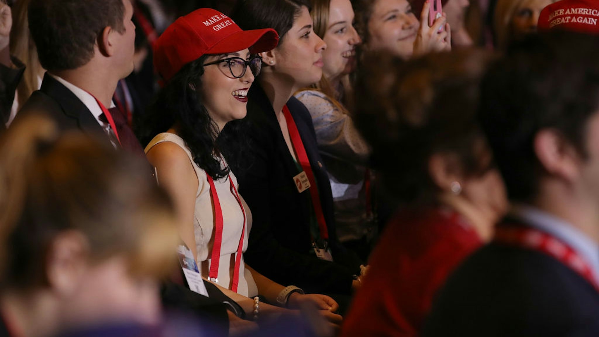Young people listen to U.S. President Donald Trump as he addresses the Conservative Political Action Conference at the Gaylord National Resort and Convention Center February 23, 2018 in National Harbor, MD.