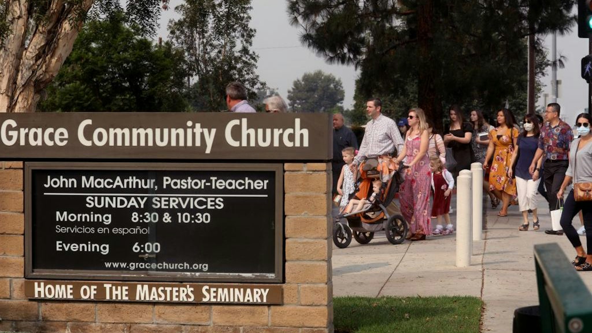 Grace Community Church parishioners make their way to Sunday service in Sun Valley on September 13, 2020. The church held a packed morning service today, defying a court order directing them to refrain from holding indoor services due to the COVID-19 pandemic. (Genaro Molina/Los Angeles Times)